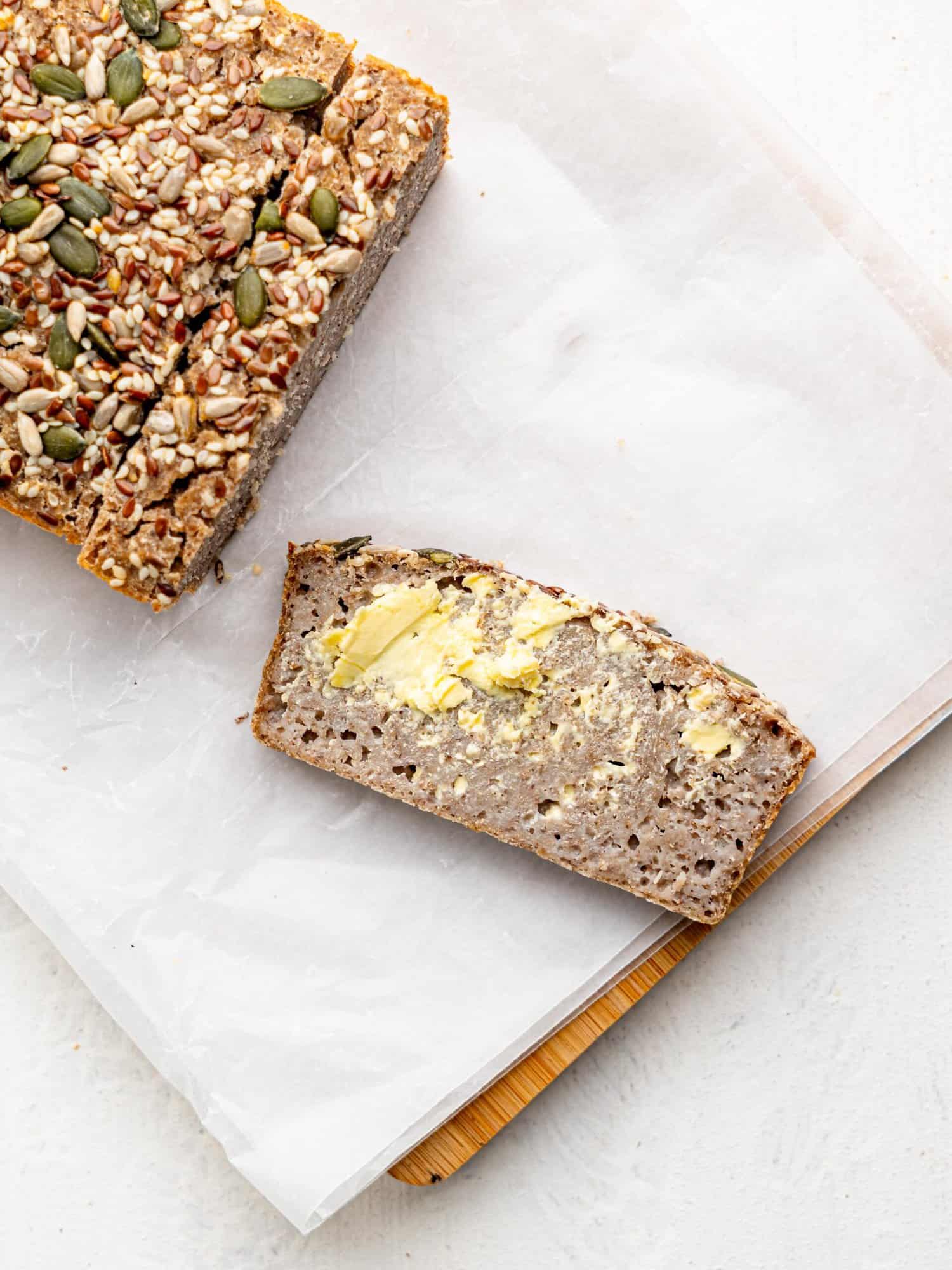 A slice of buckwheat bread with butter.
