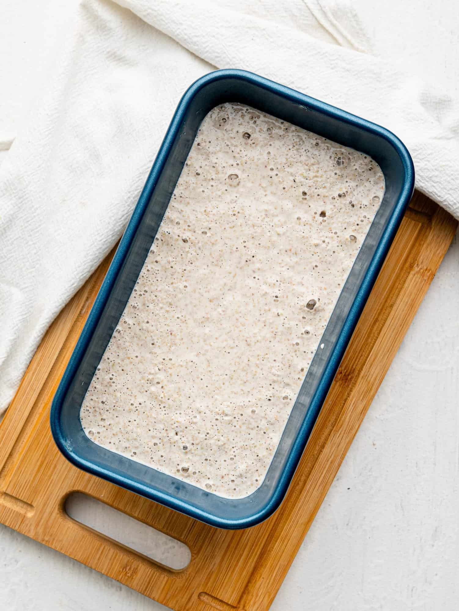 Buckwheat bread mixture in a loaf pan.