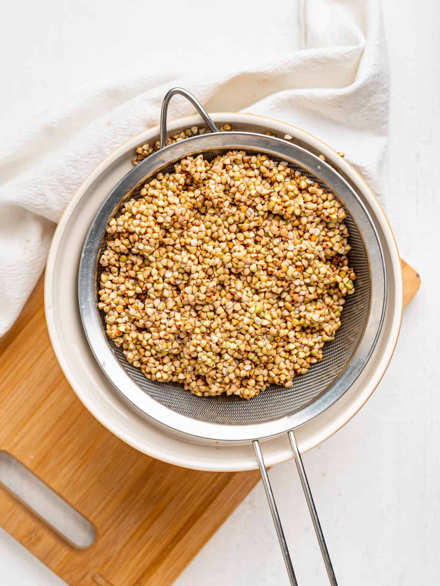 Drained buckwheat groats in a sieve after soaking
