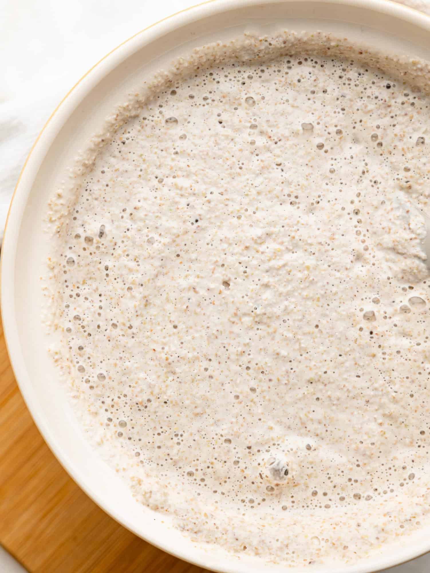 Buckwheat bread mixture in a bowl after fermentation.