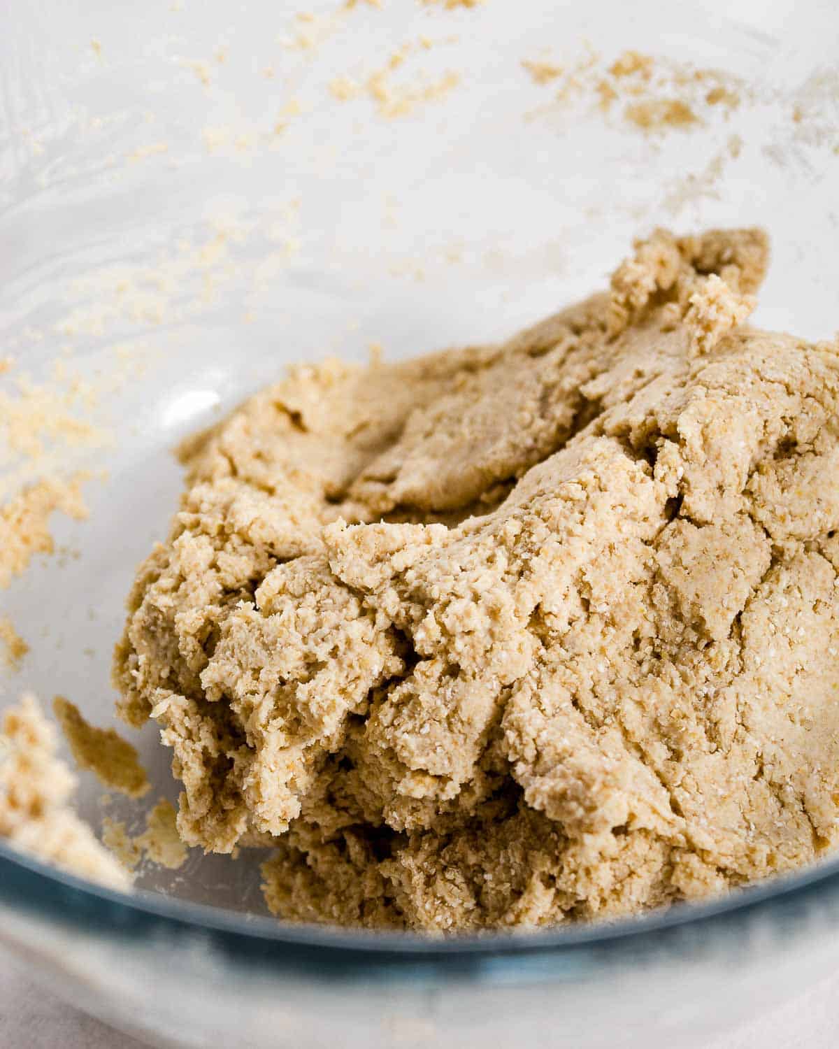 Oat Flour Pizza Dough in a glass bowl.