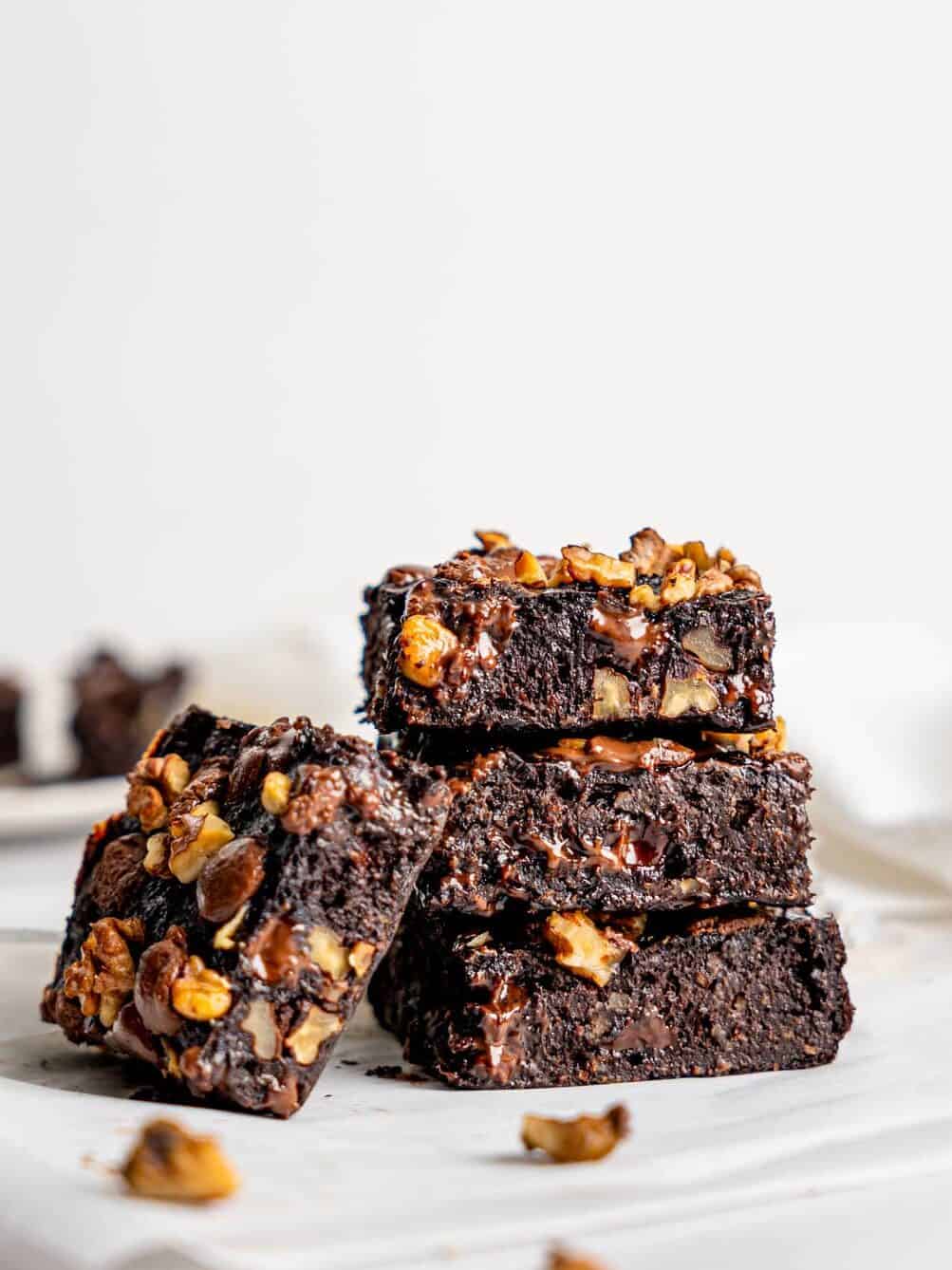A stack of healthy banana brownies with walnuts and chocolate.
