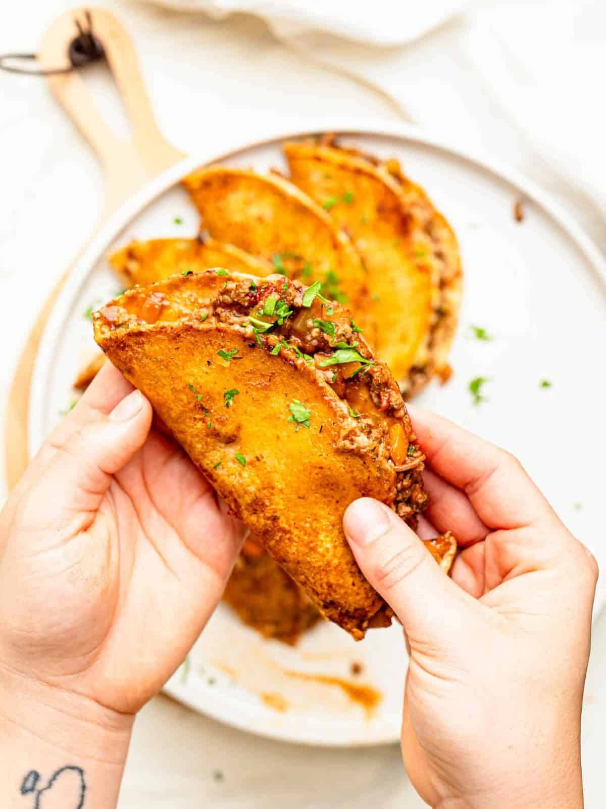 Cheesy Bolognese Birria Tacos in soft white corn tortillas.