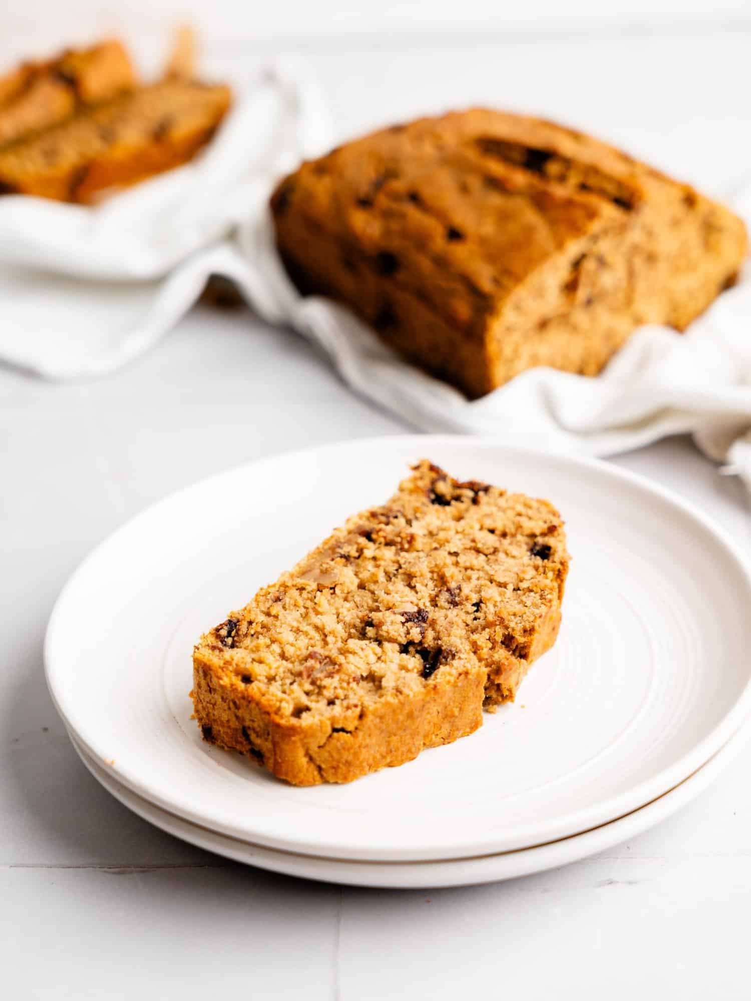 A slice of oat flour banana bread on a plate.