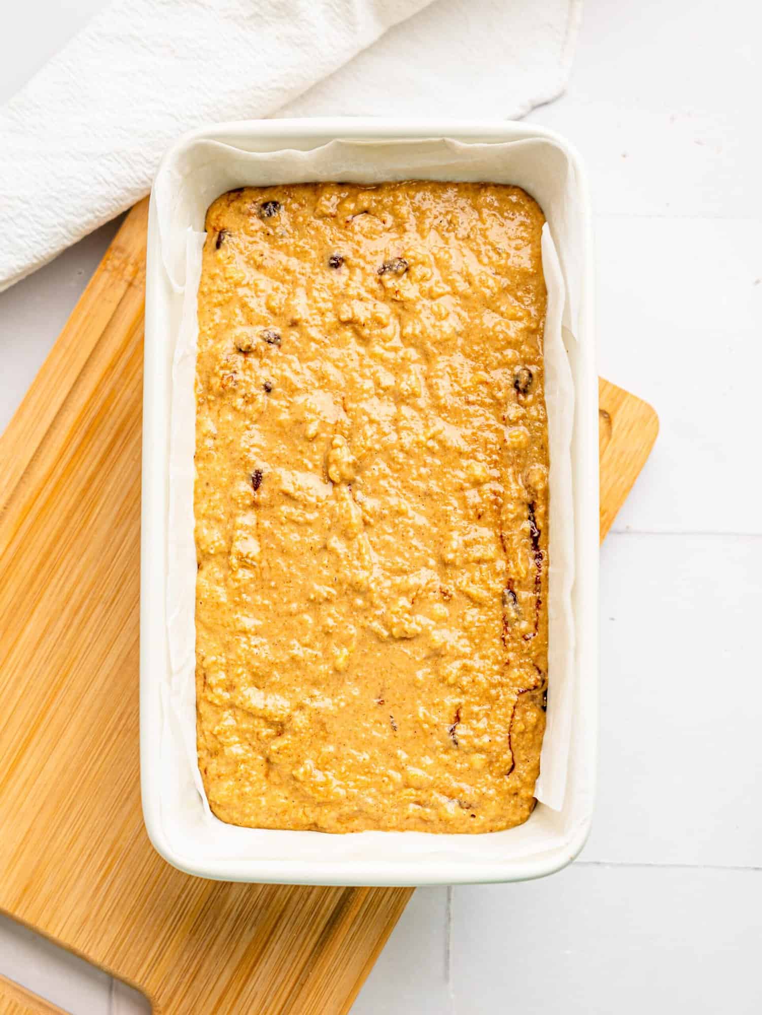 Banana bread batter in a loaf tin.