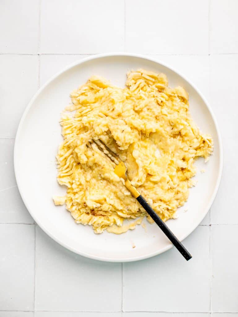 Mashed banana on a plate.