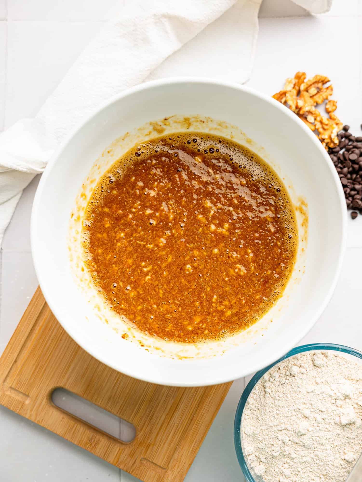 Wet ingredients for healthy banana bread combined in a bowl.