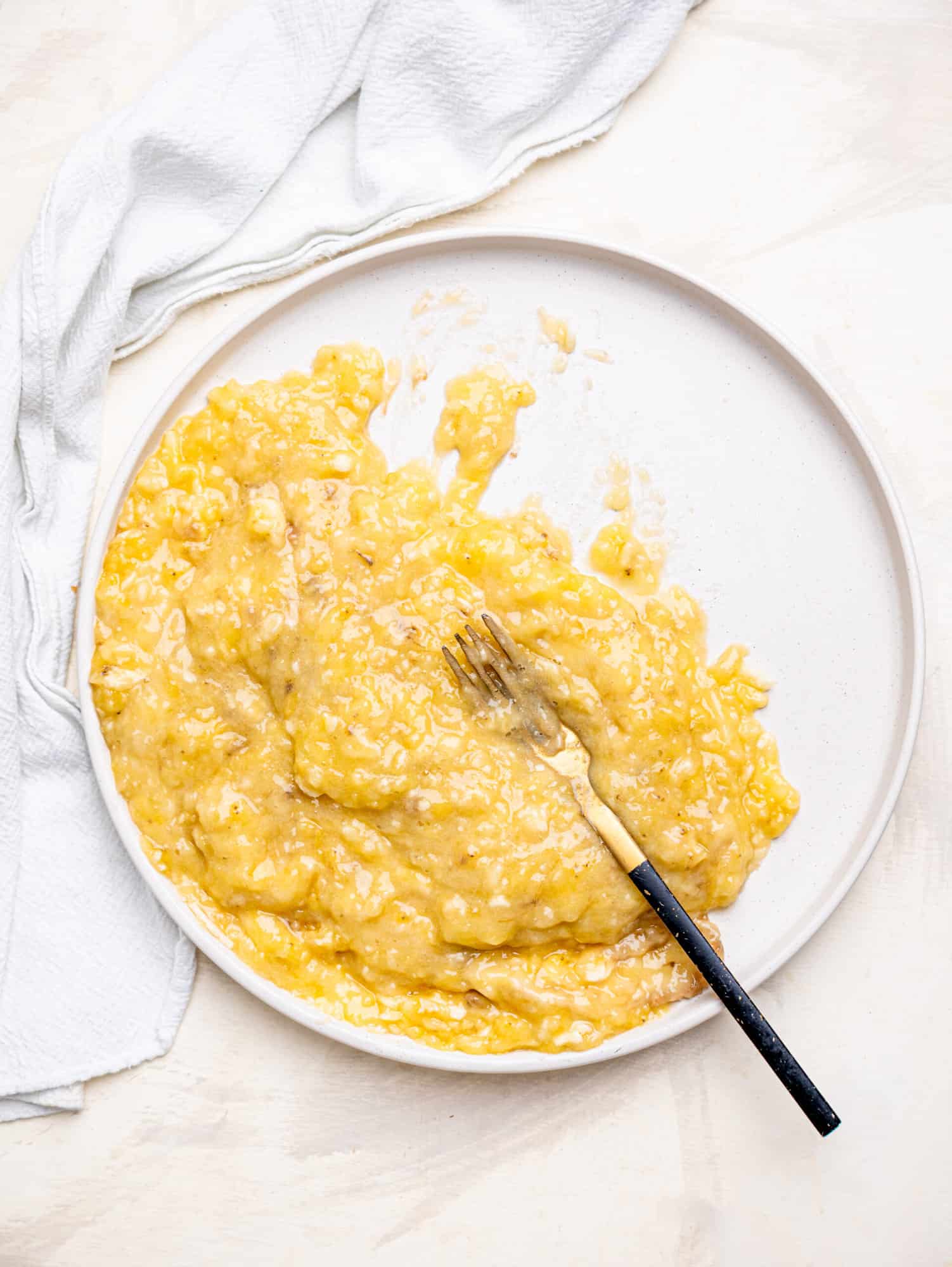 Mashed ripe bananas for healthy banana oatmeal muffins.
