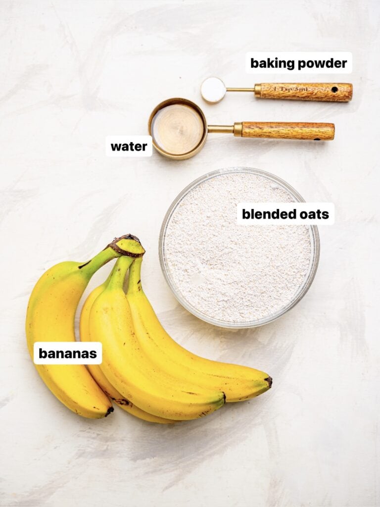 3-Ingredient banana oatmeal muffins recipe ingredients - blended oats, banana, water, and baking powder.