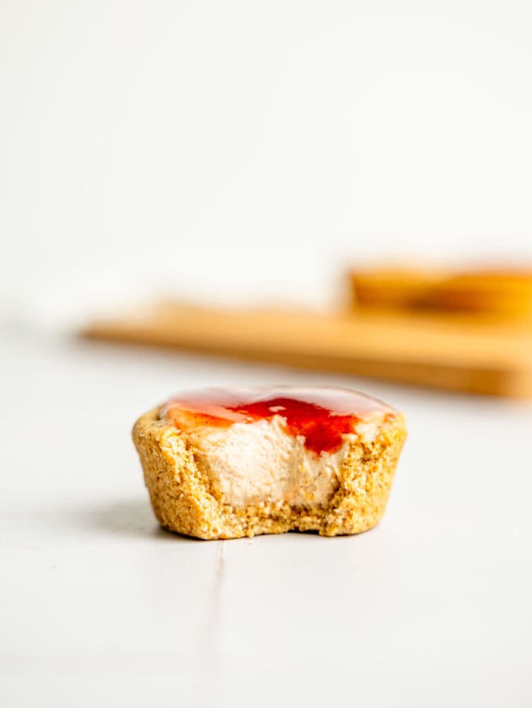 A half-eaten mini protein cheesecake.