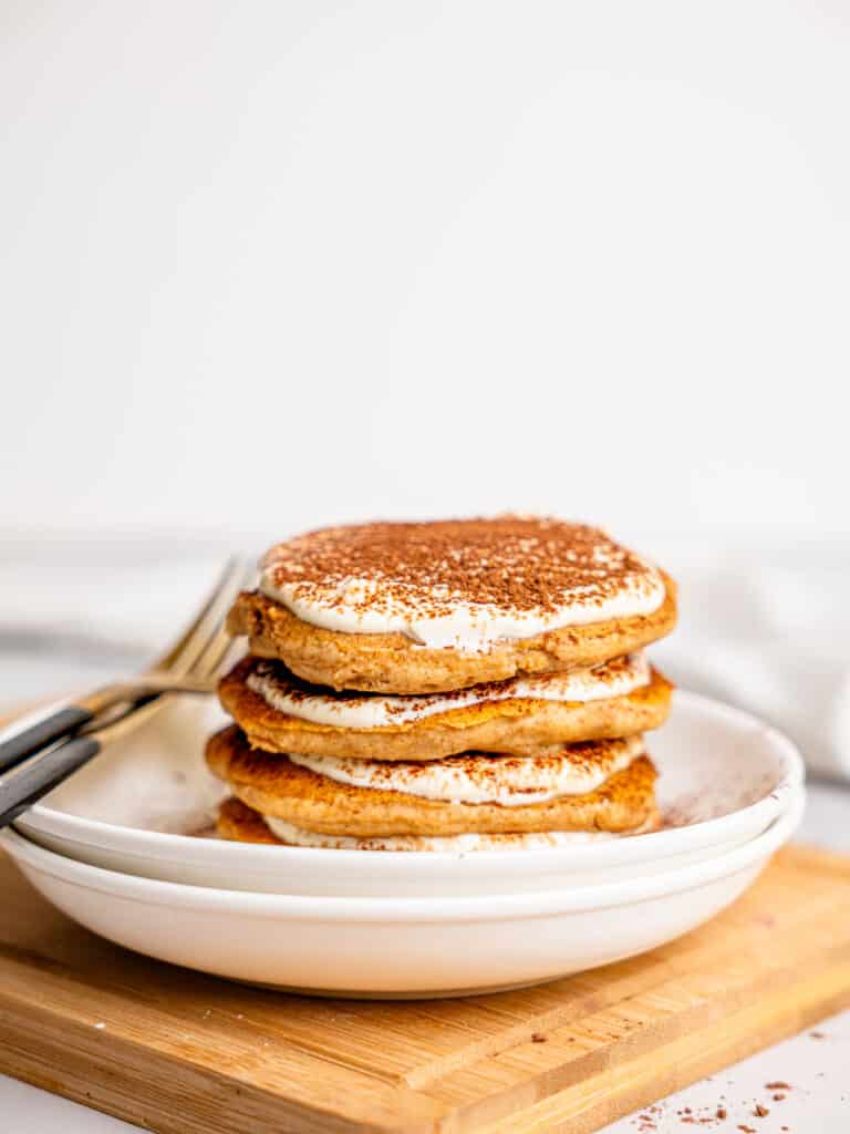 A stack of tiramisu pancakes on a plate.
