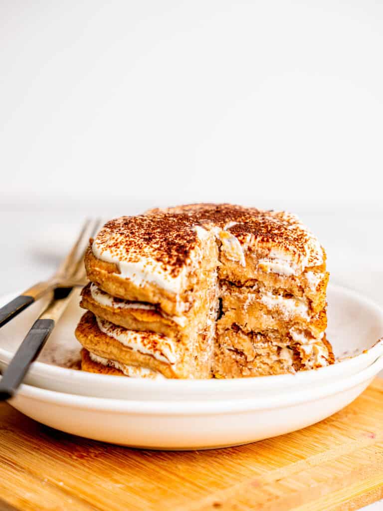A stack of tiramisu pancake half-eaten.