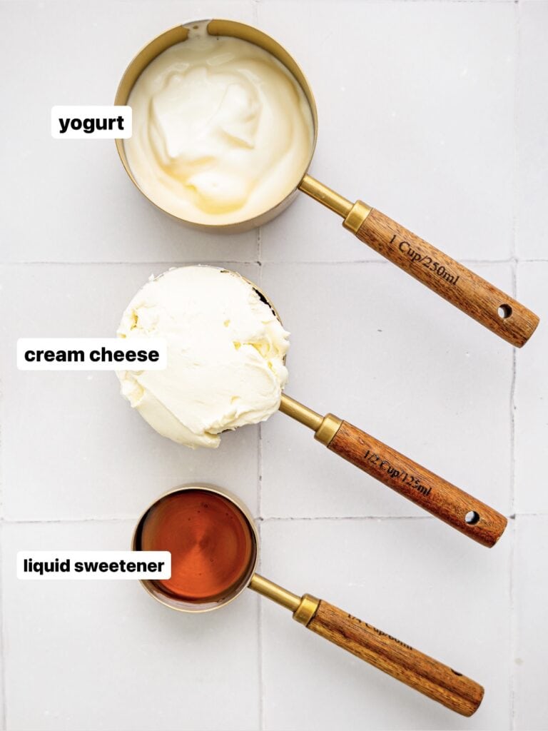 Healthy Cream Cheese Frosting Ingredients in measuring cups.