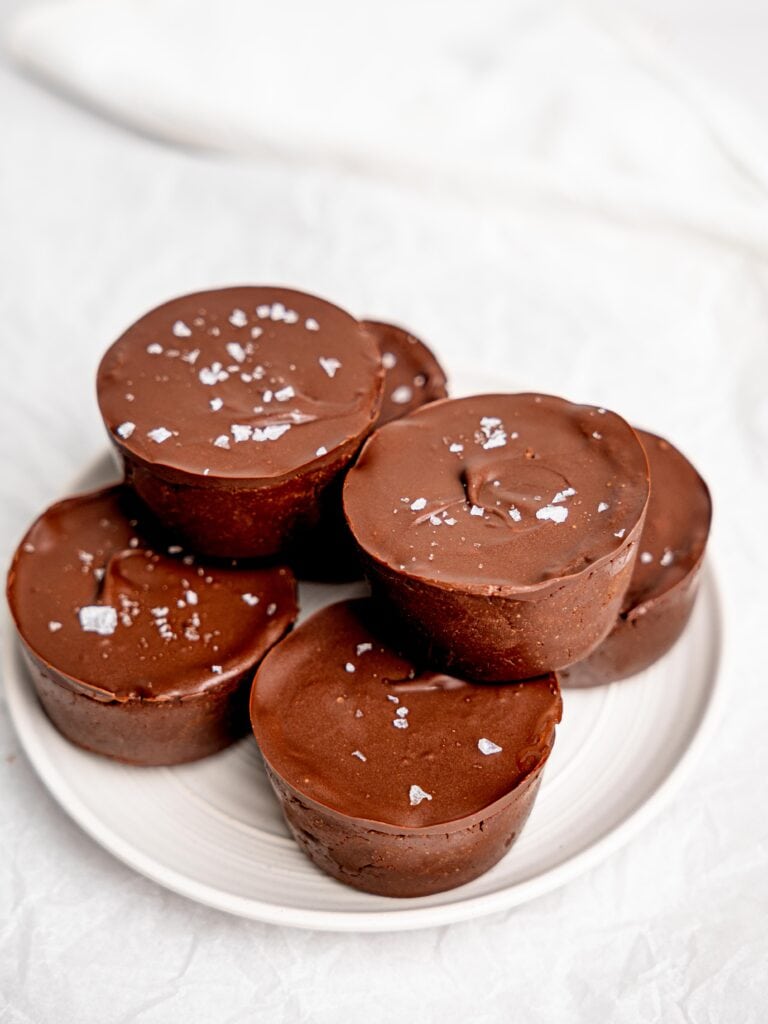 A plate of mini triple chocolate cheesecakes.