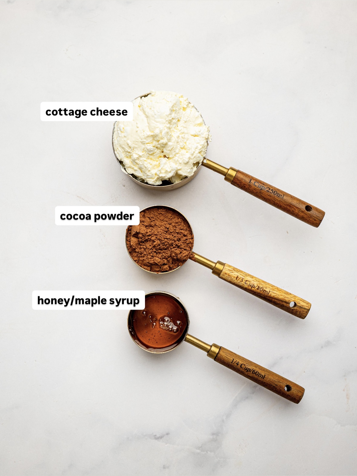 Ingredients for Healthy Cottage Cheese Chocolate Mousse: cottage cheese, unsweetened cocoa powder, and honey.