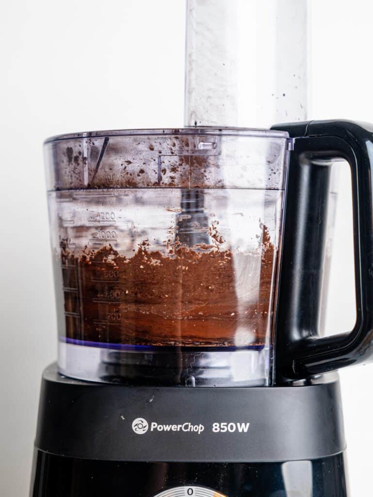 Blending cottage cheese fudge ingredients in a food processor.