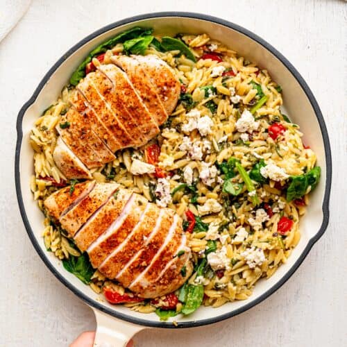 Chicken and Orzo Bake in a white skillet.