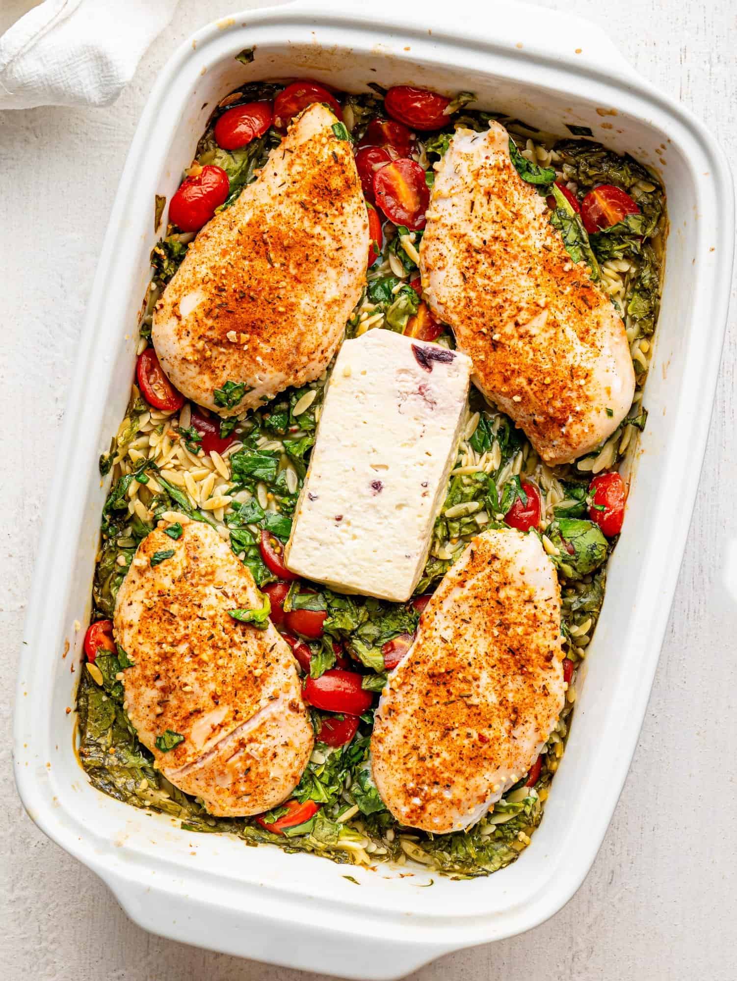 Chicken and Orzo Bake in a white casserole dish.