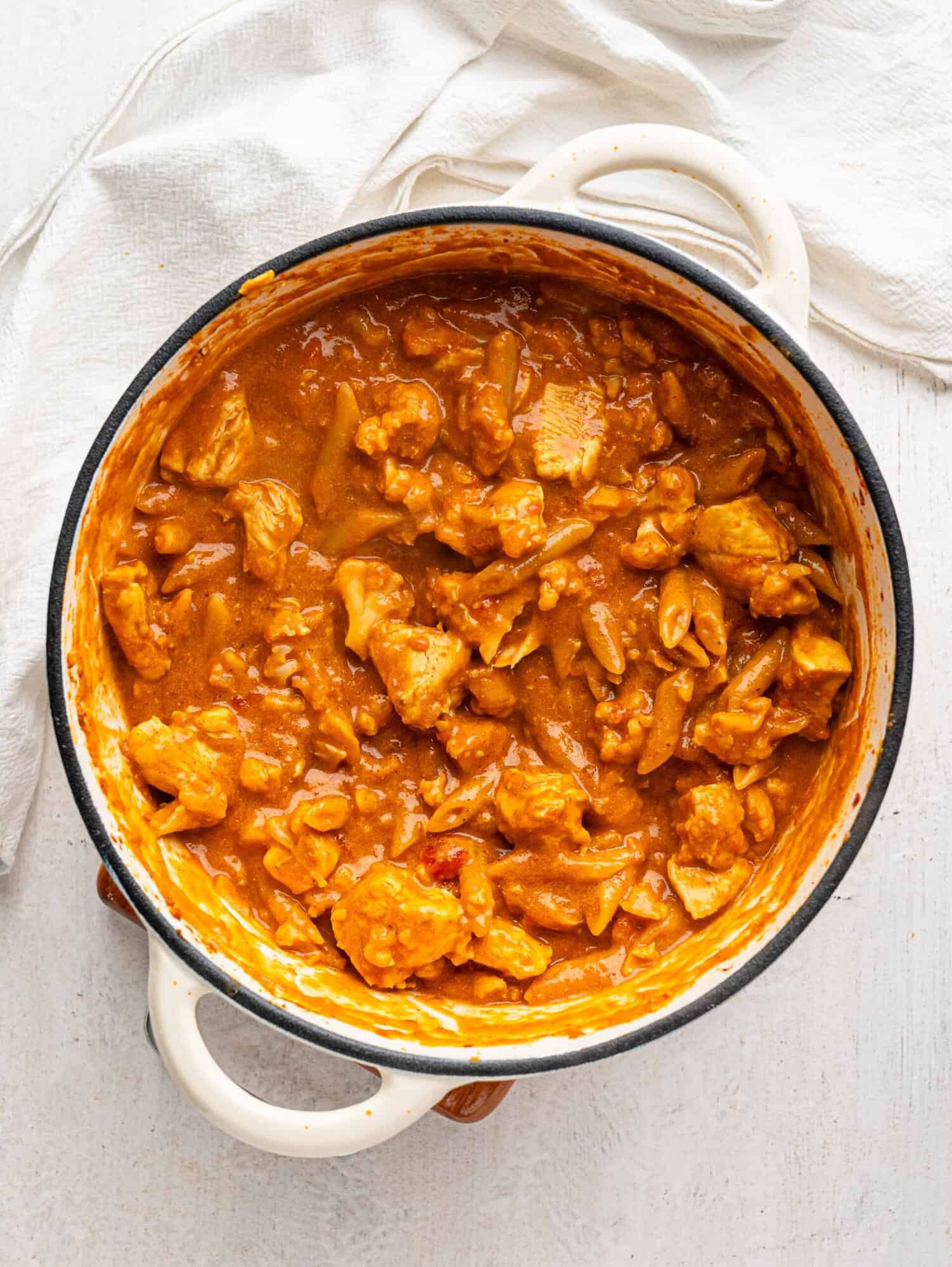 Butter Chicken Pasta in a large white pot.