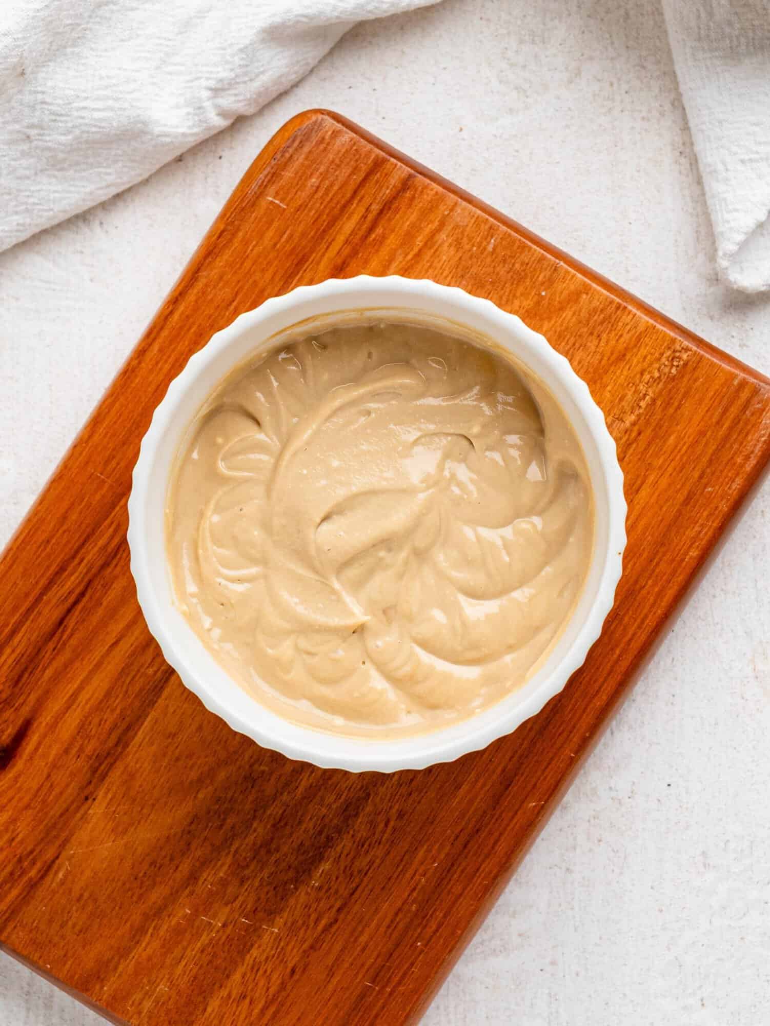 Healthy coffee frosting in a wite bowl.