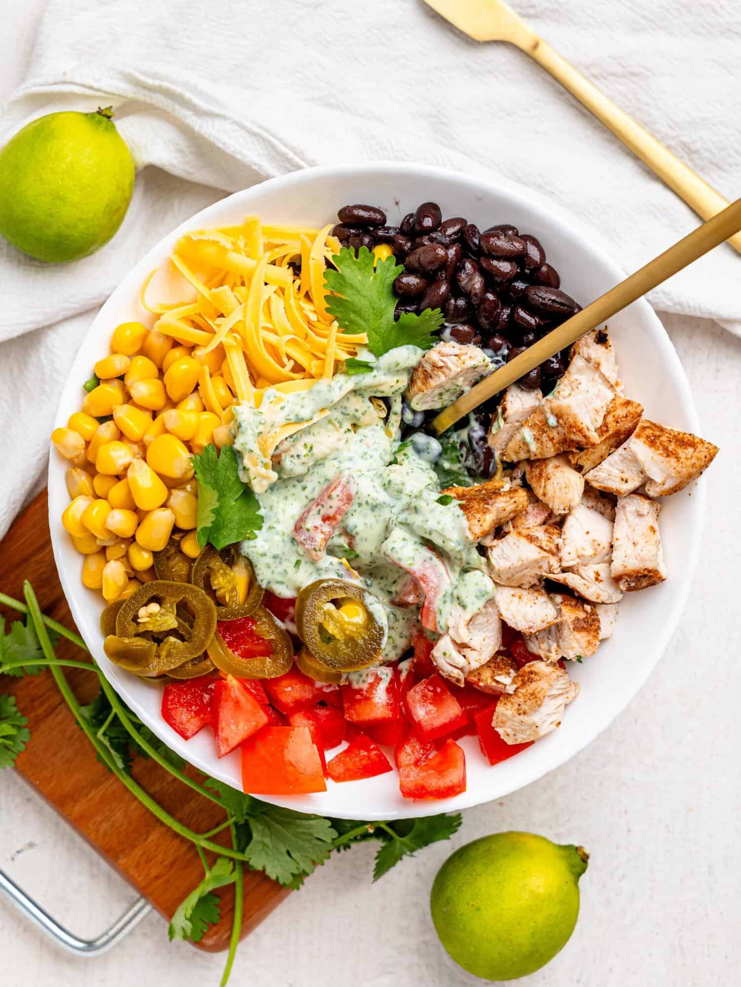 Mexican Chicken Salad ingredients in a white bowl.