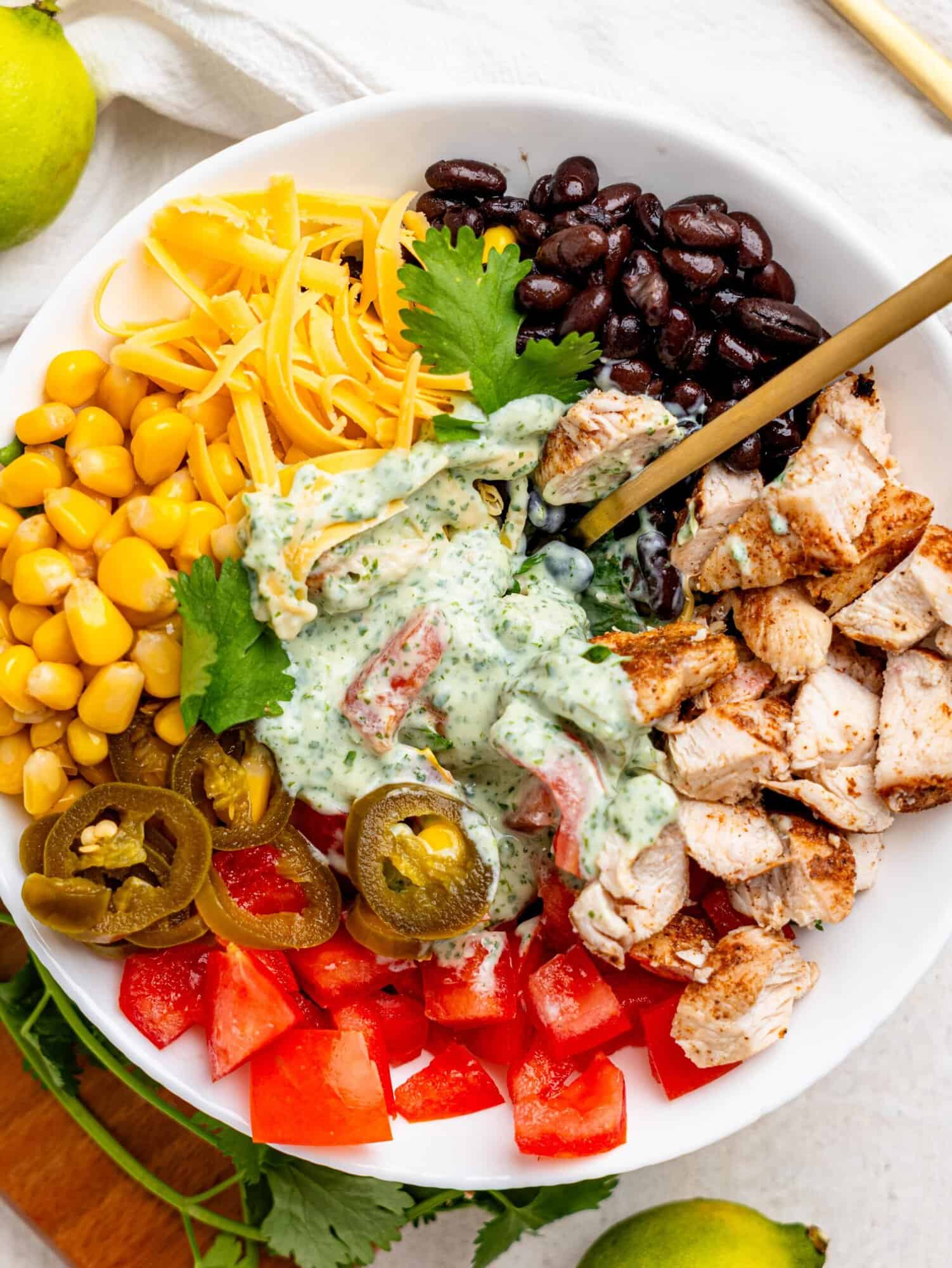 Mexican Chicken Salad ingredients in a white bowl.