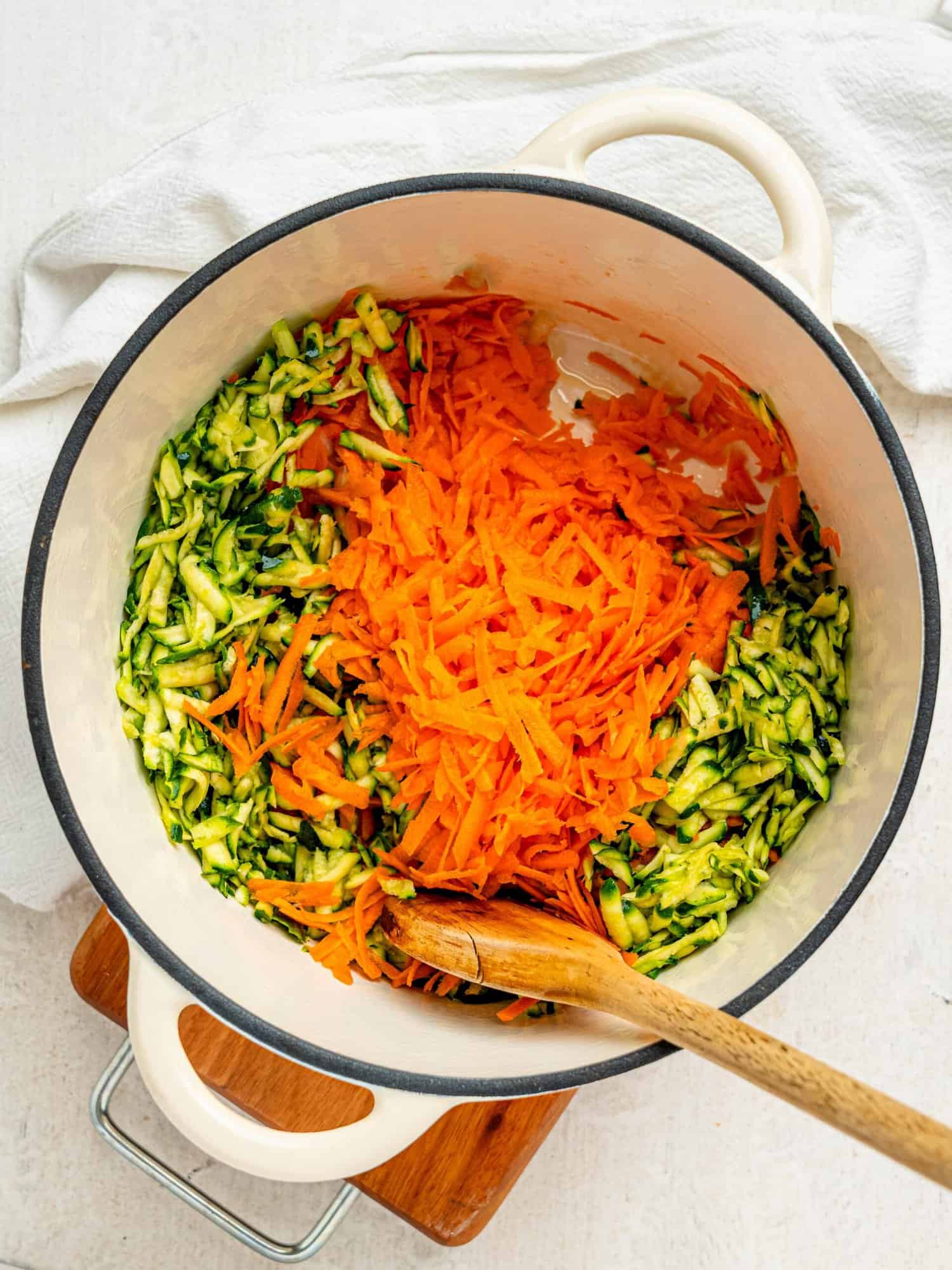 Onion, carrot and white onion in a large pot.