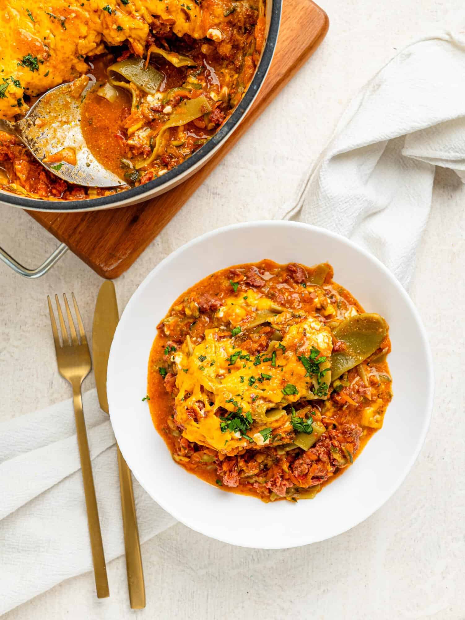 Lasagna in a white bowl.
