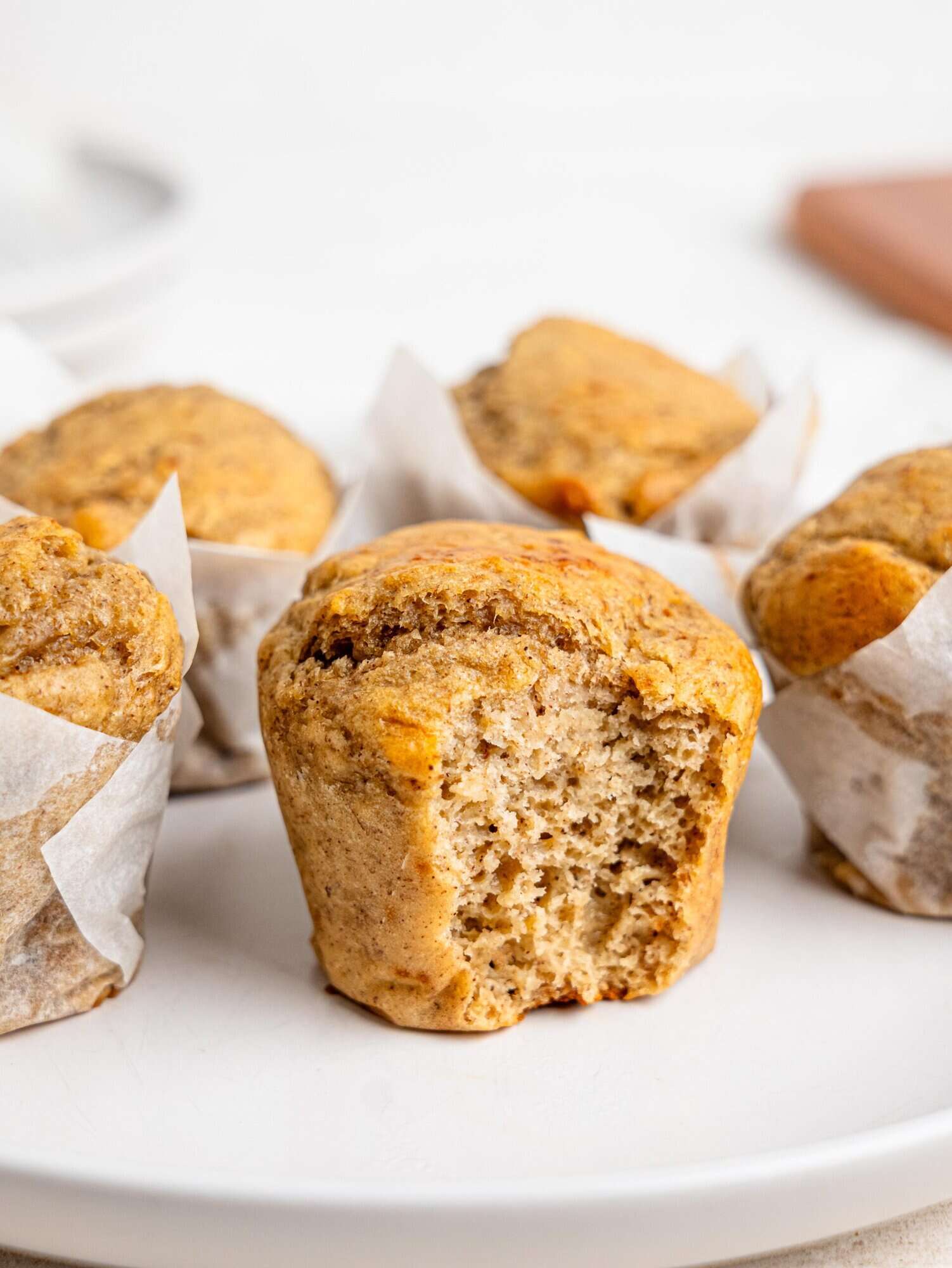 Banana cottage cheese muffins on a white plate.