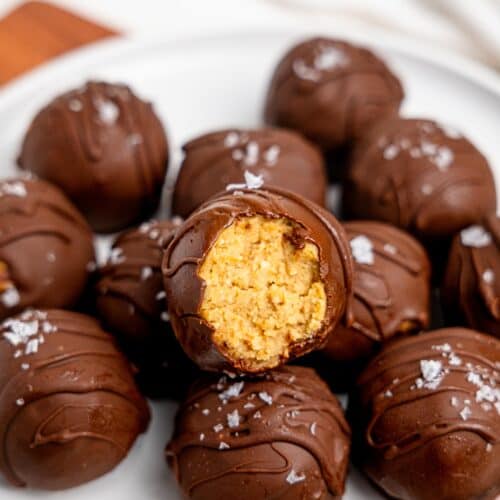 Chickpea cookie dough truffles on a white plate.
