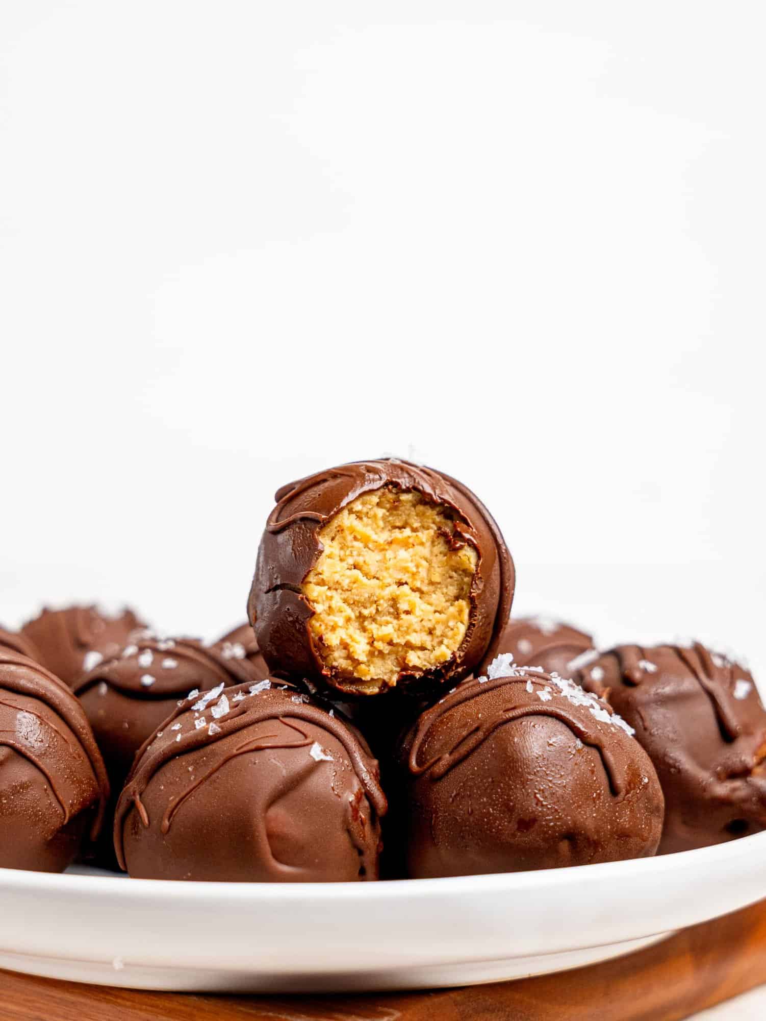 Chickpea cookie dough truffles on a white plate.