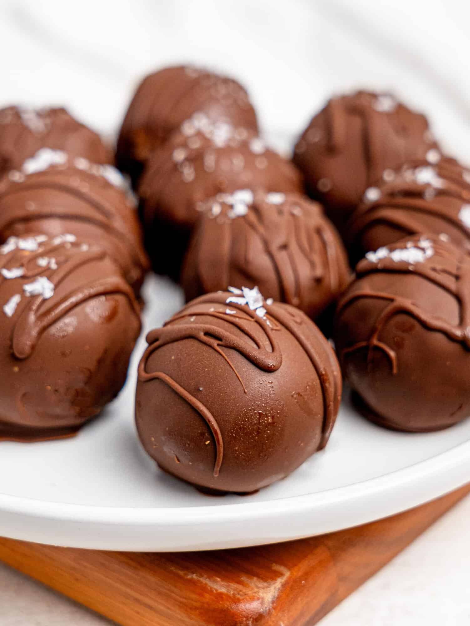 Chickpea cookie dough truffles on a white plate.