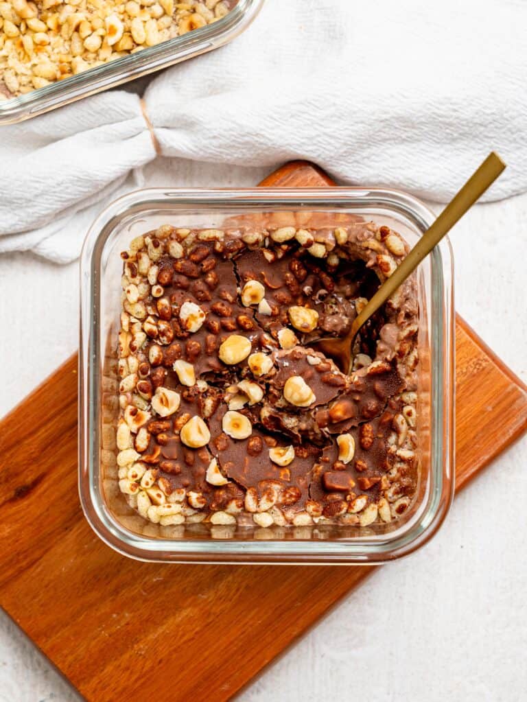 Meal-prep Ferrero Rocher Protein Overnight Oats with chocolate shell.