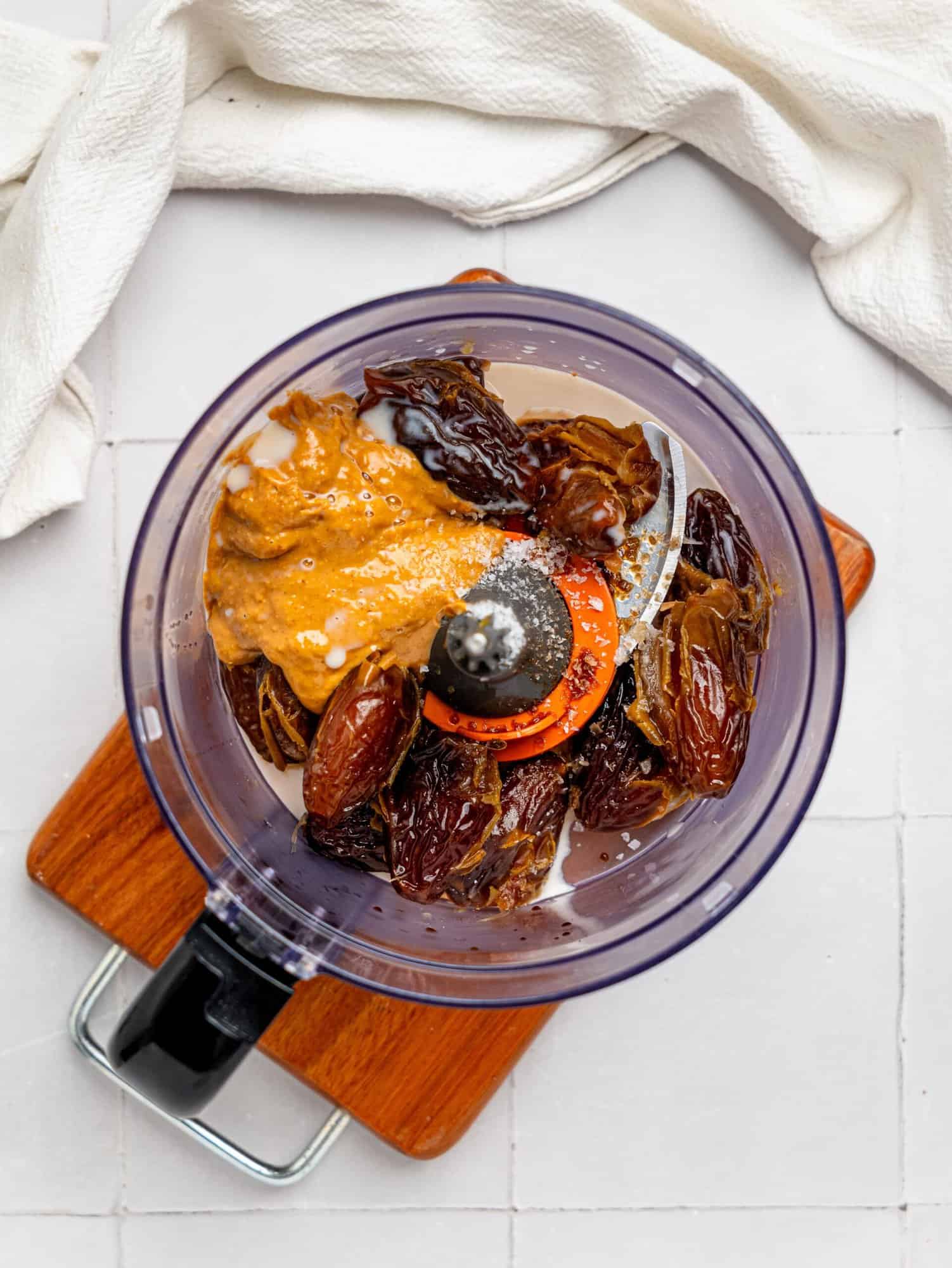 Date caramel ingredients in a food processor.