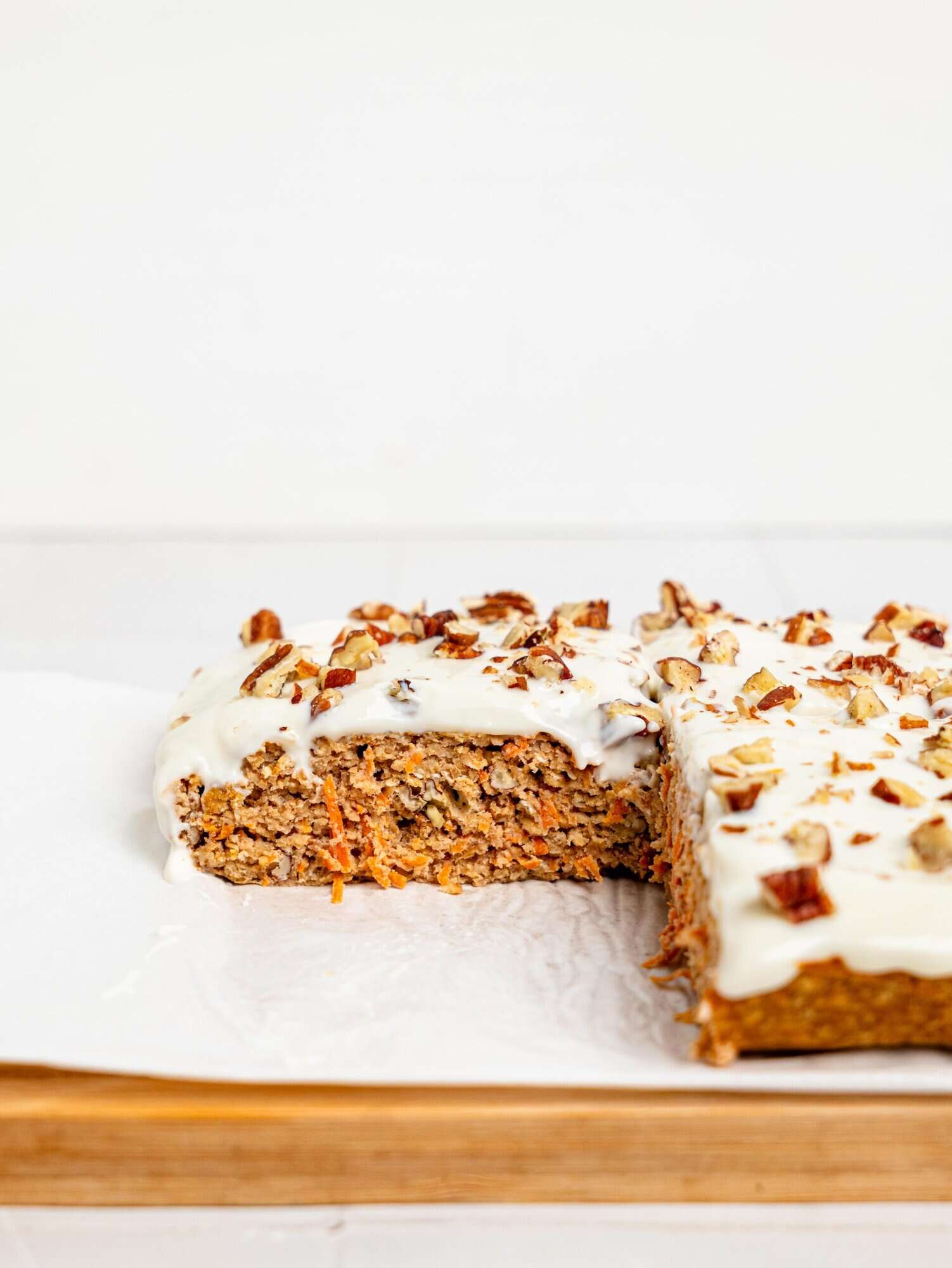 Carrot cake baked oatmeal on a chopping board.