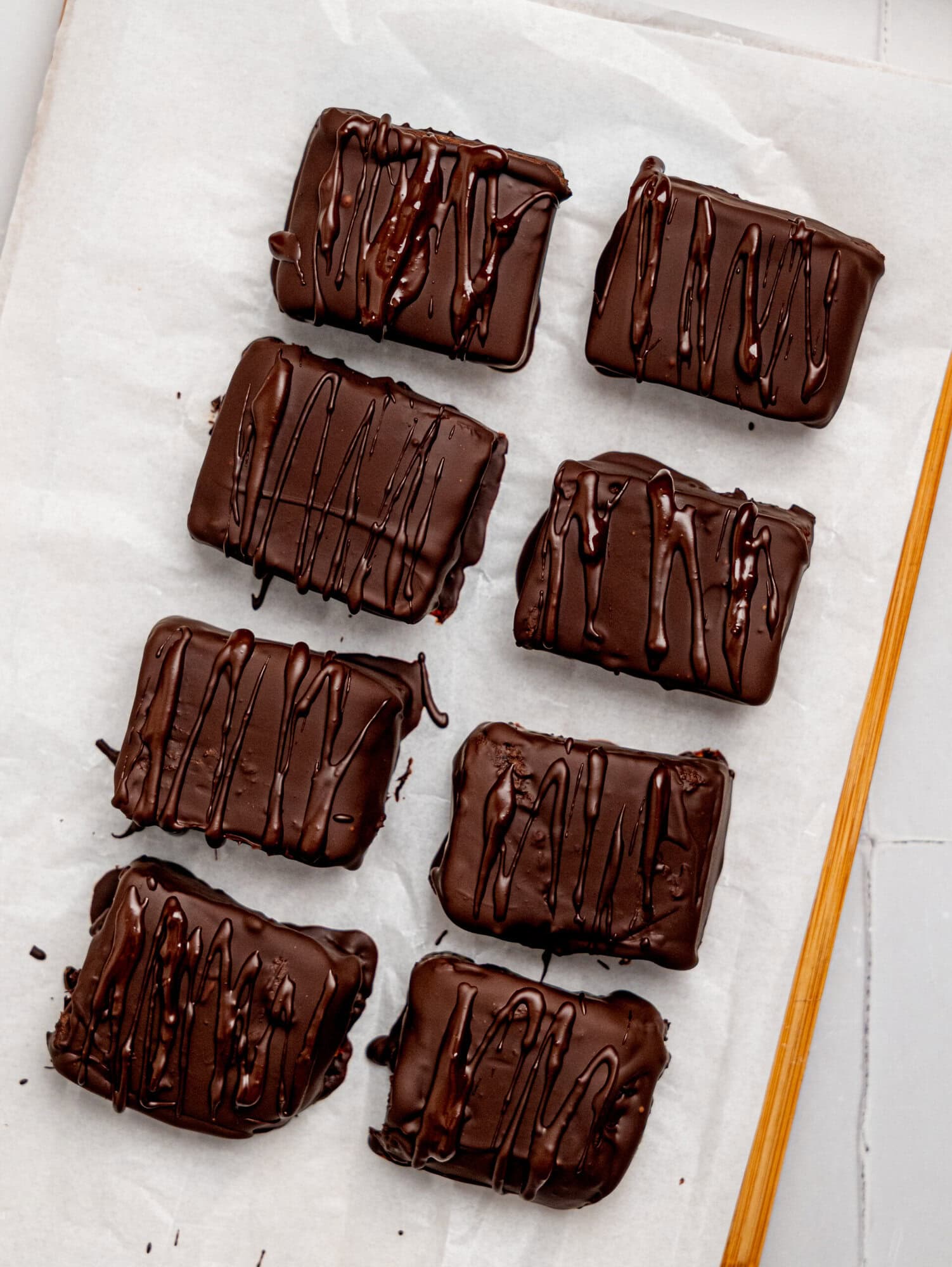 No-bake black bean brownies dipped in dark chocolate.