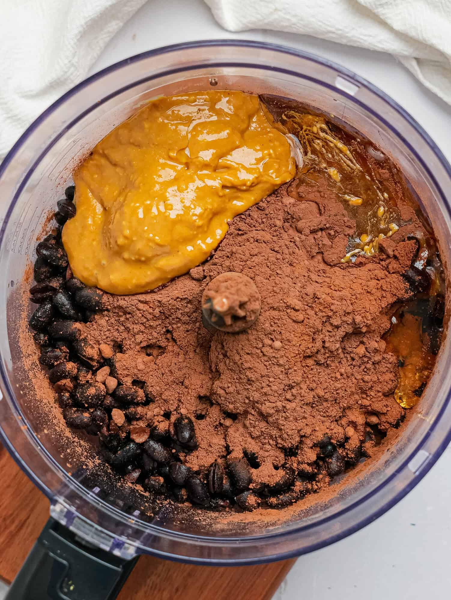 Black bean brownie ingredients in a food processor.