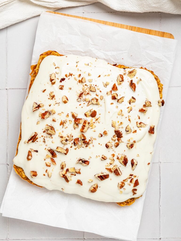 Carrot cake baked oatmeal on a chopping board.