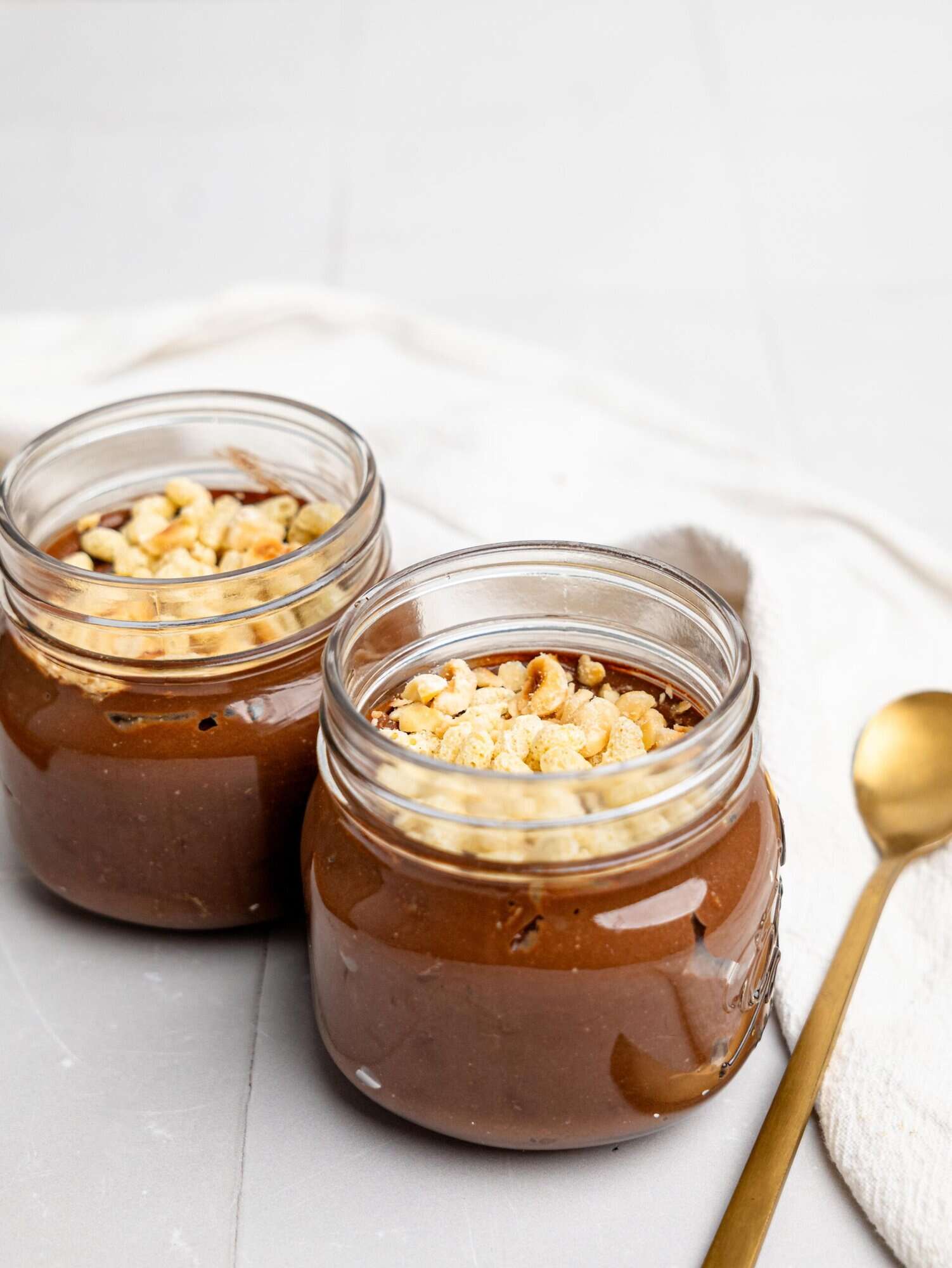 Two jars of Ferrero Rocher Cottage Cheese Chocolate Pudding.