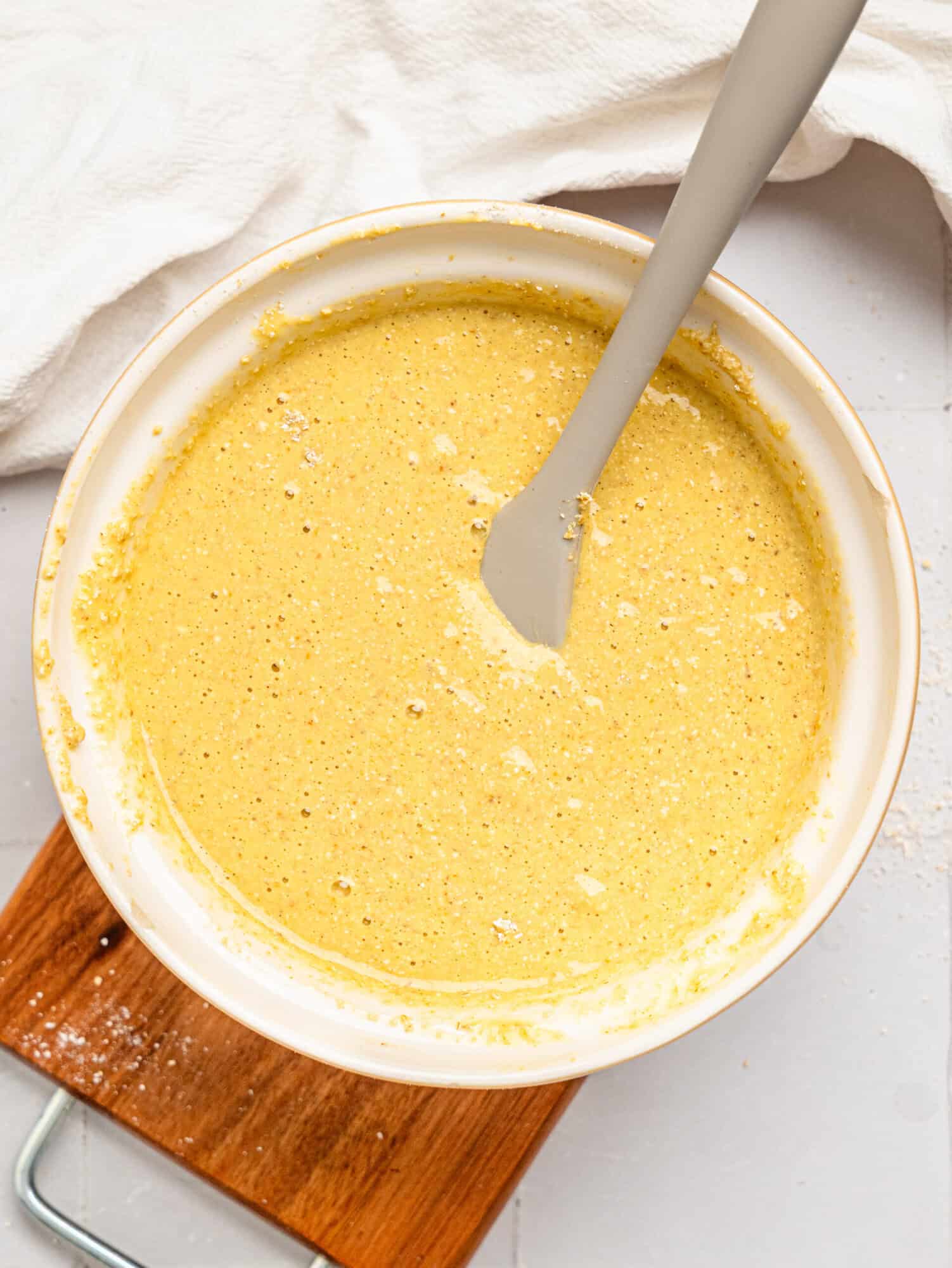 Oat flour bread batter in a mixing bowl.