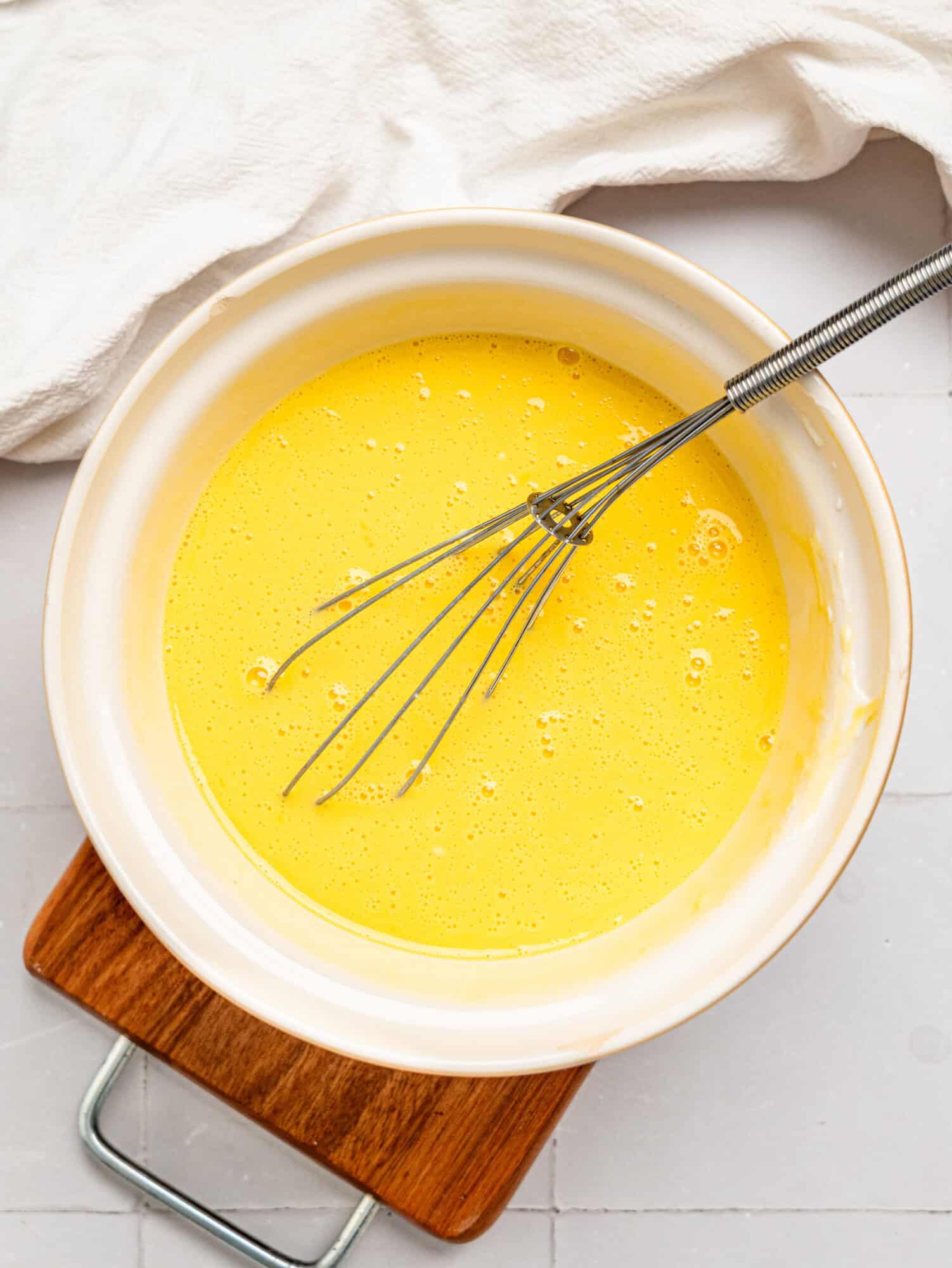 Oat flour bread wet ingredients in a mixing bowl.