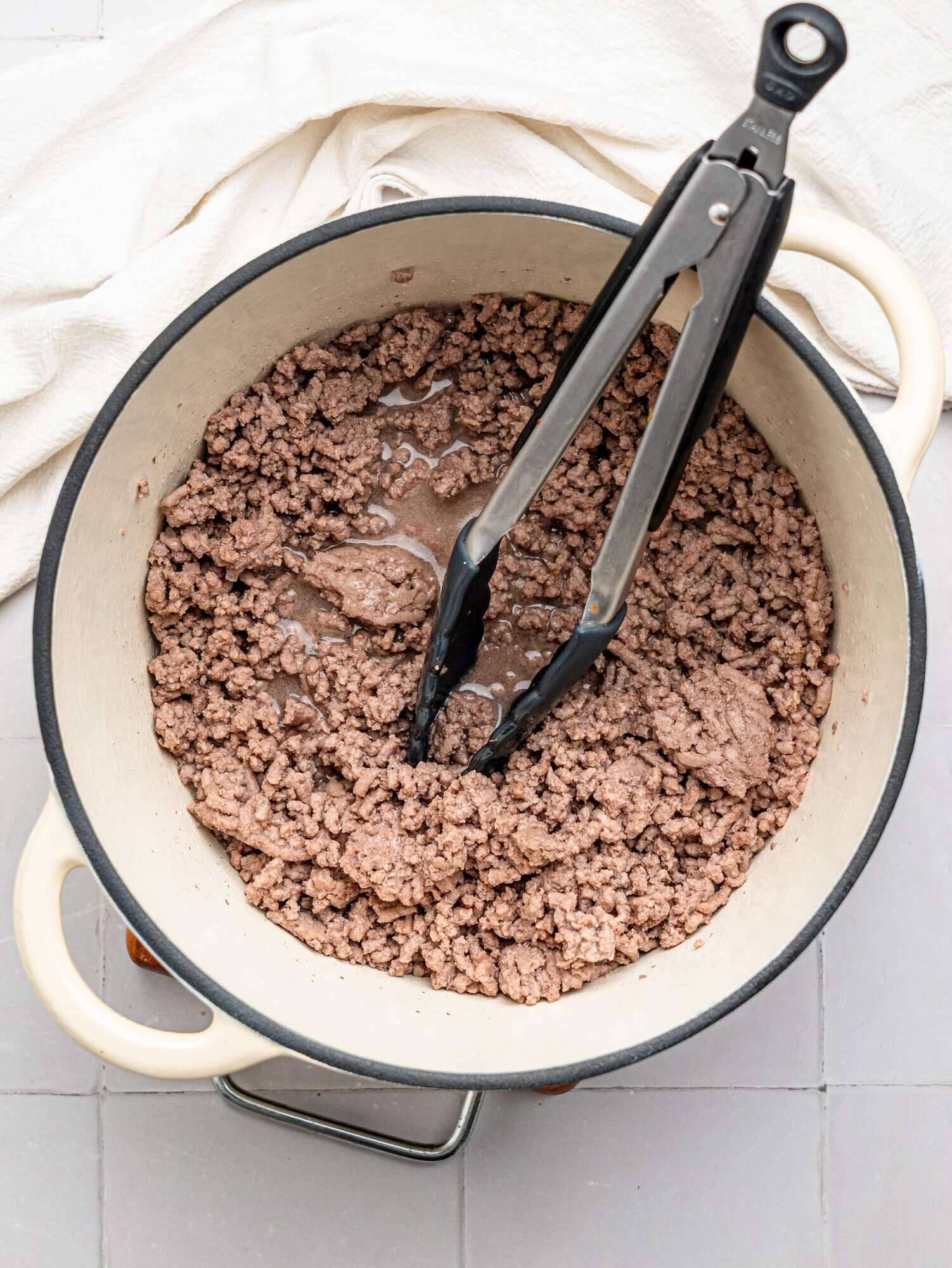 Cooked beef mince in a large pot.
