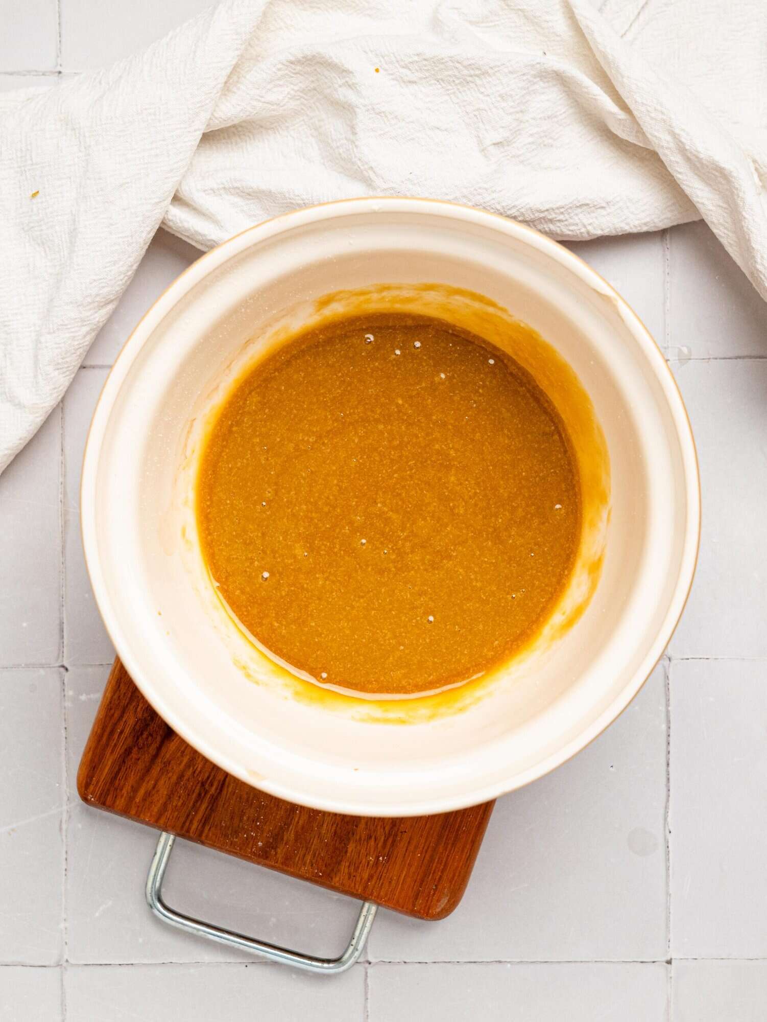 Oat flour blondie batter wet ingredients in a mixing bowl.