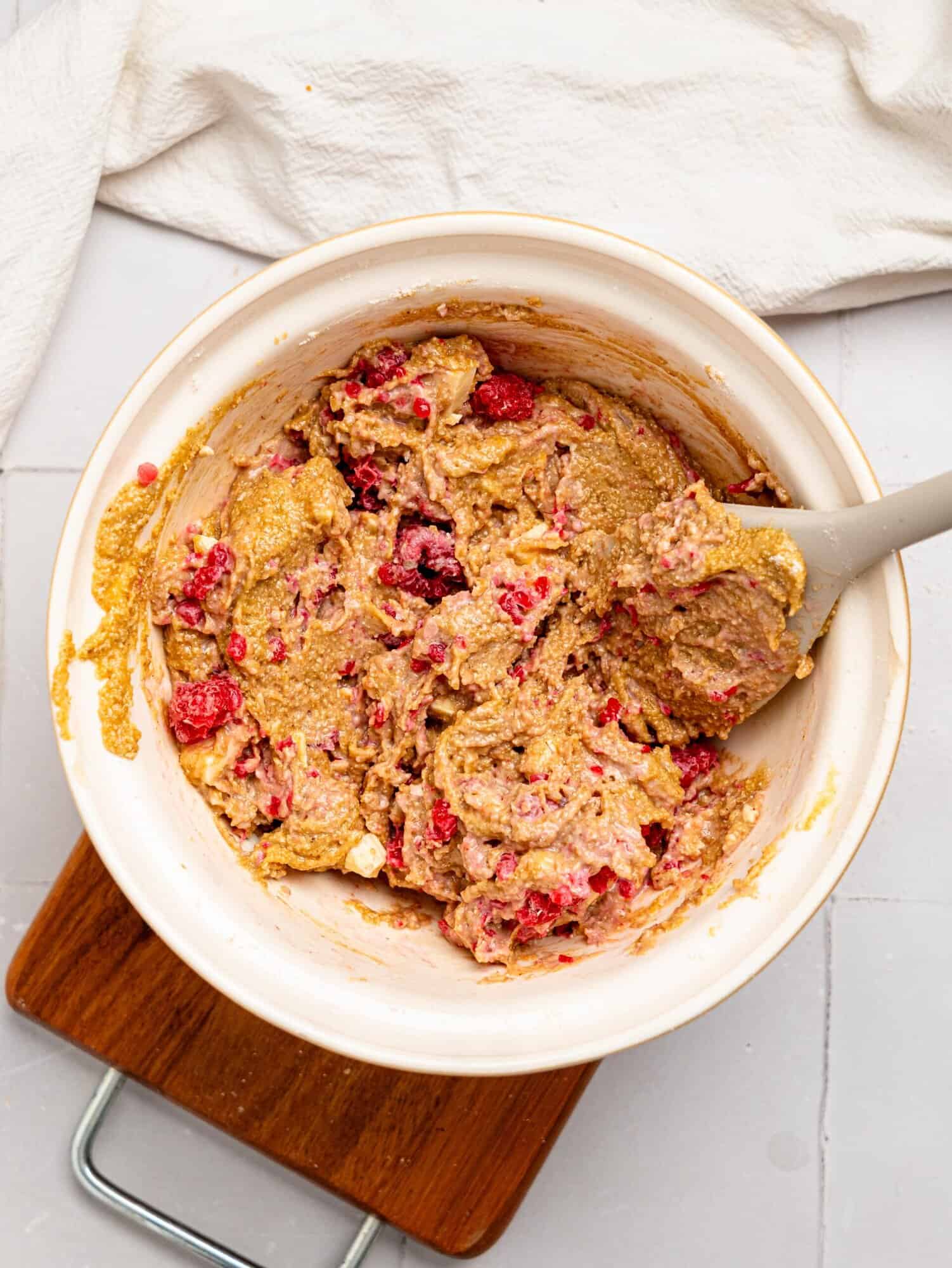 White chocolate and raspberry blondie batter in a mixing bowl.