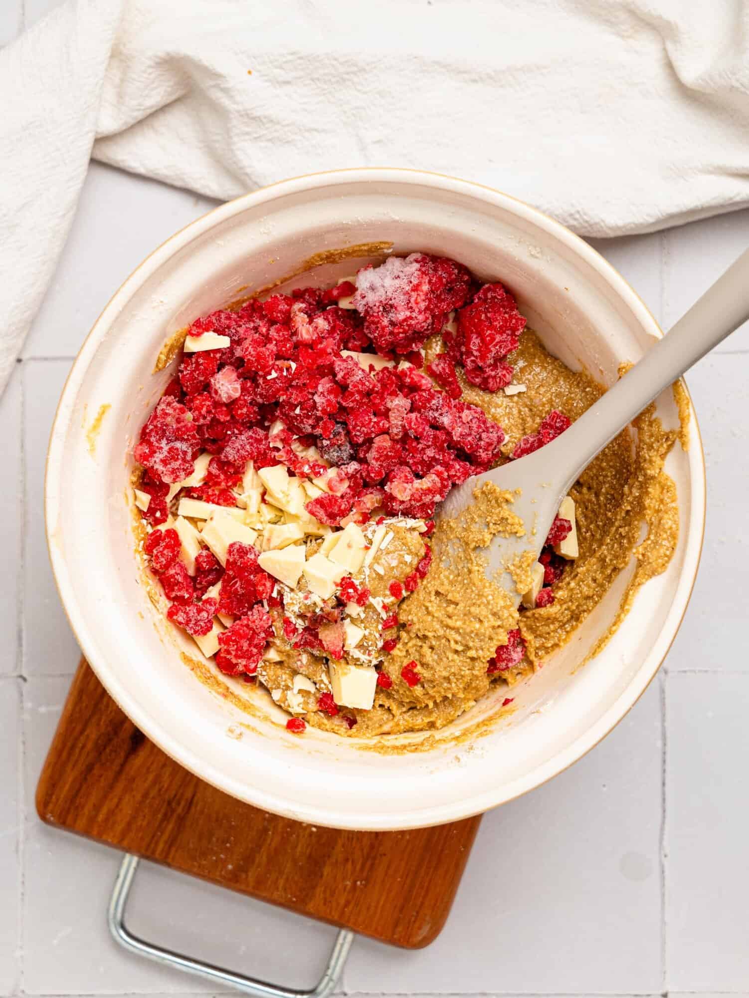 White chocolate and raspberry blondie batter in a mixing bowl.