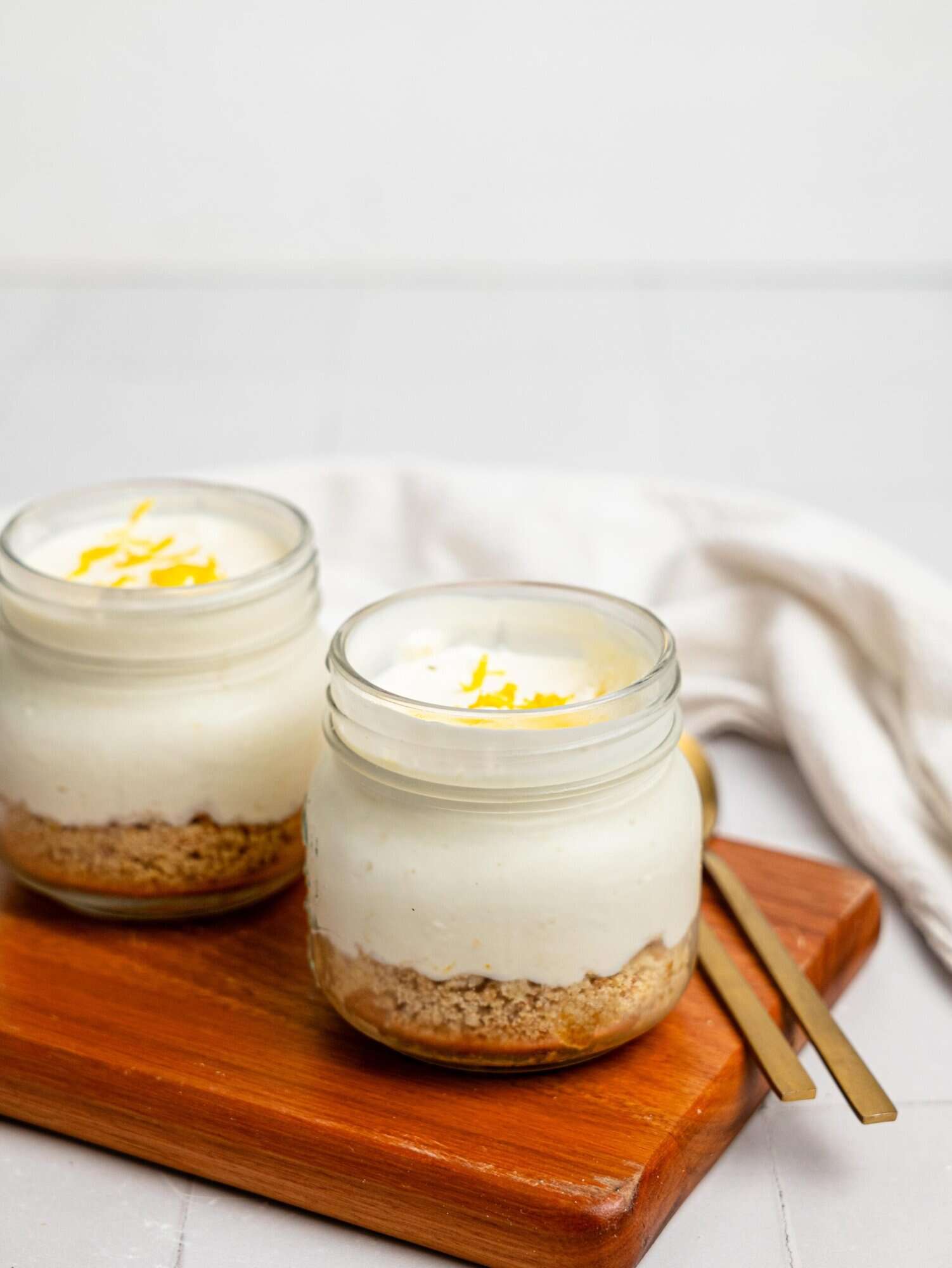 Two lemon cheesecake pots.