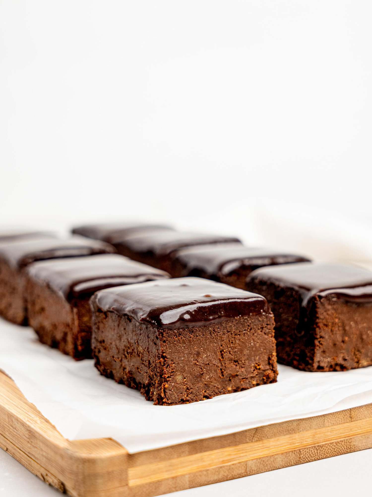 Chocolate Ganache Brownies on a cutting board.