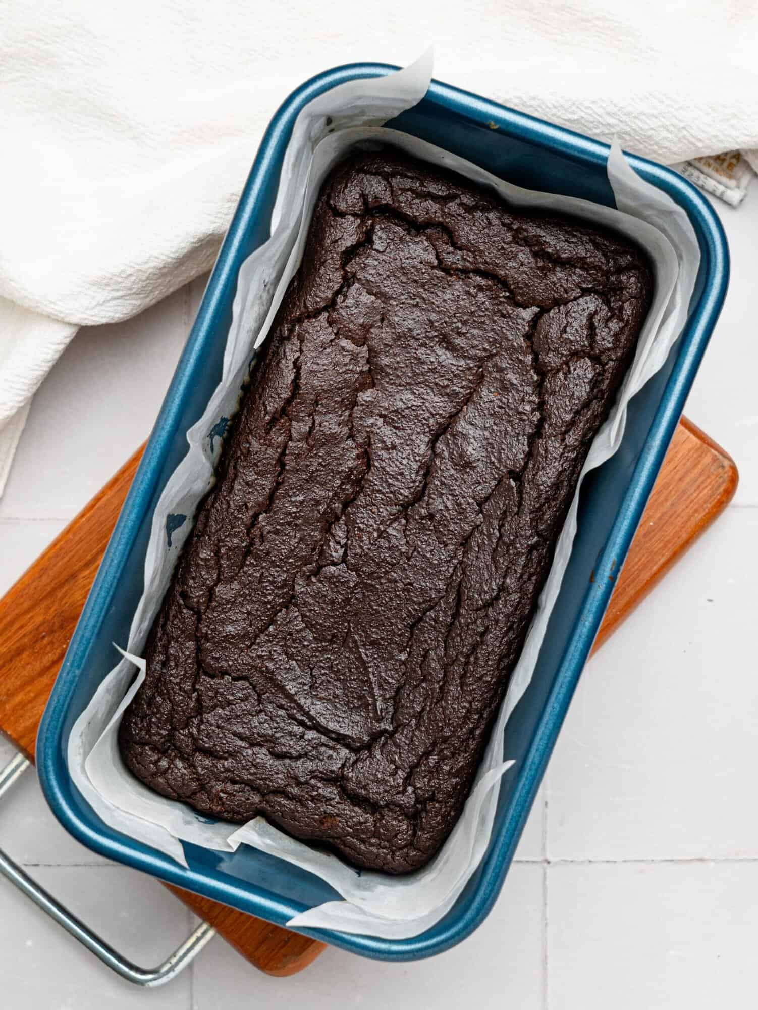 Freshly baked chocolate brownies in a loaf pan.