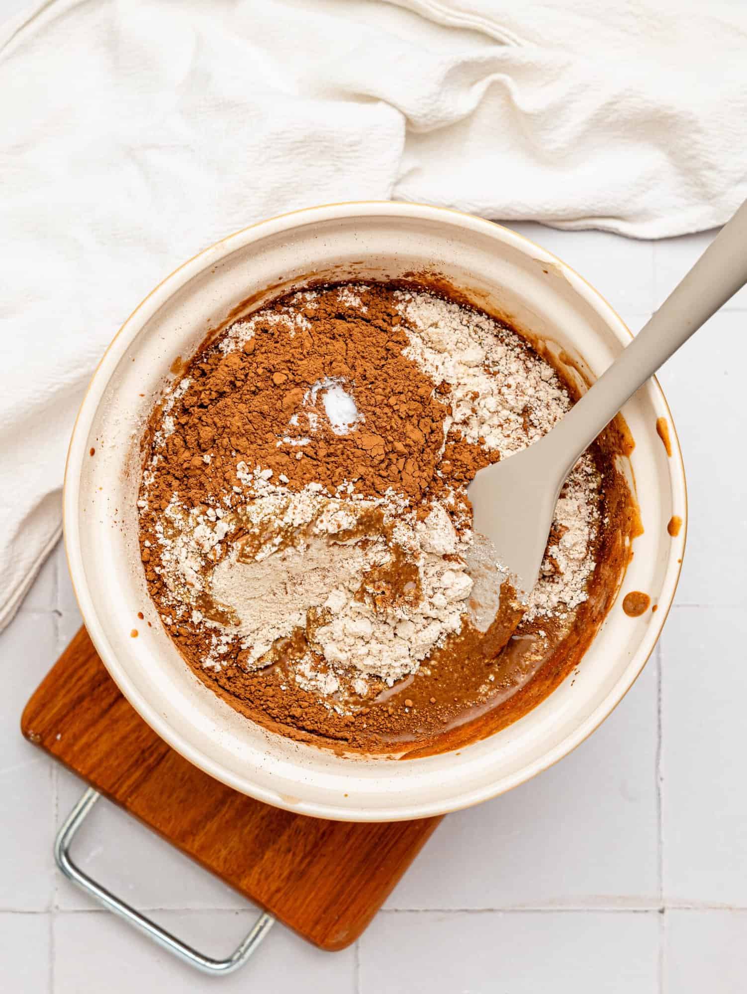 Healthy chocolate brownie batter ingredients in a mixing bowl.