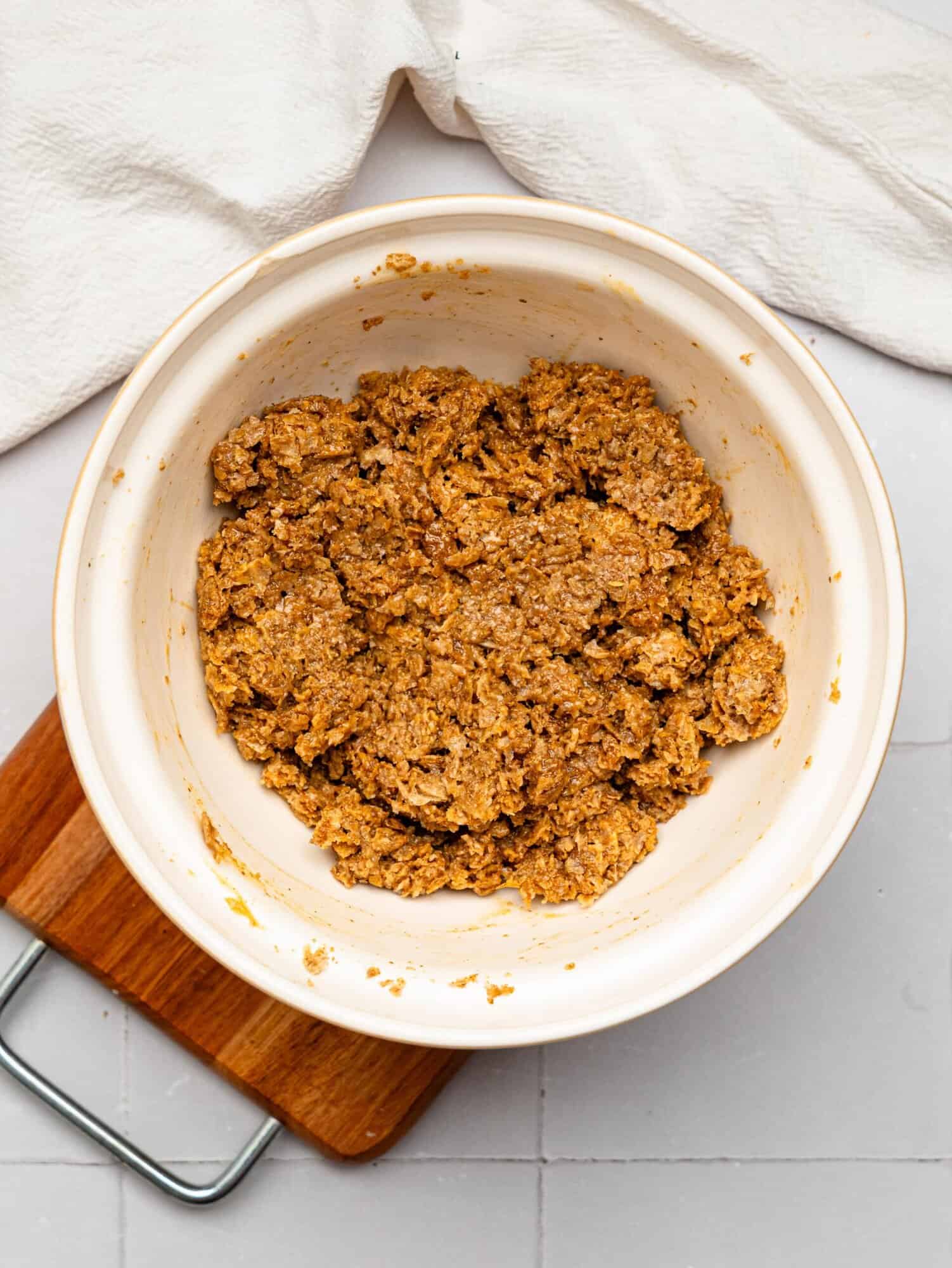 Peanut BUtter Weetabix cups base mixture in a mixing bowl.
